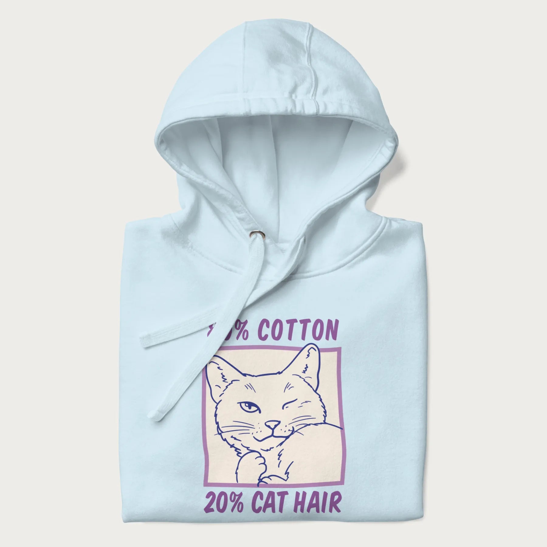 Folded light blue hoodie with graphic of a winking cat with the text "80% cotton 20% cat hair".
