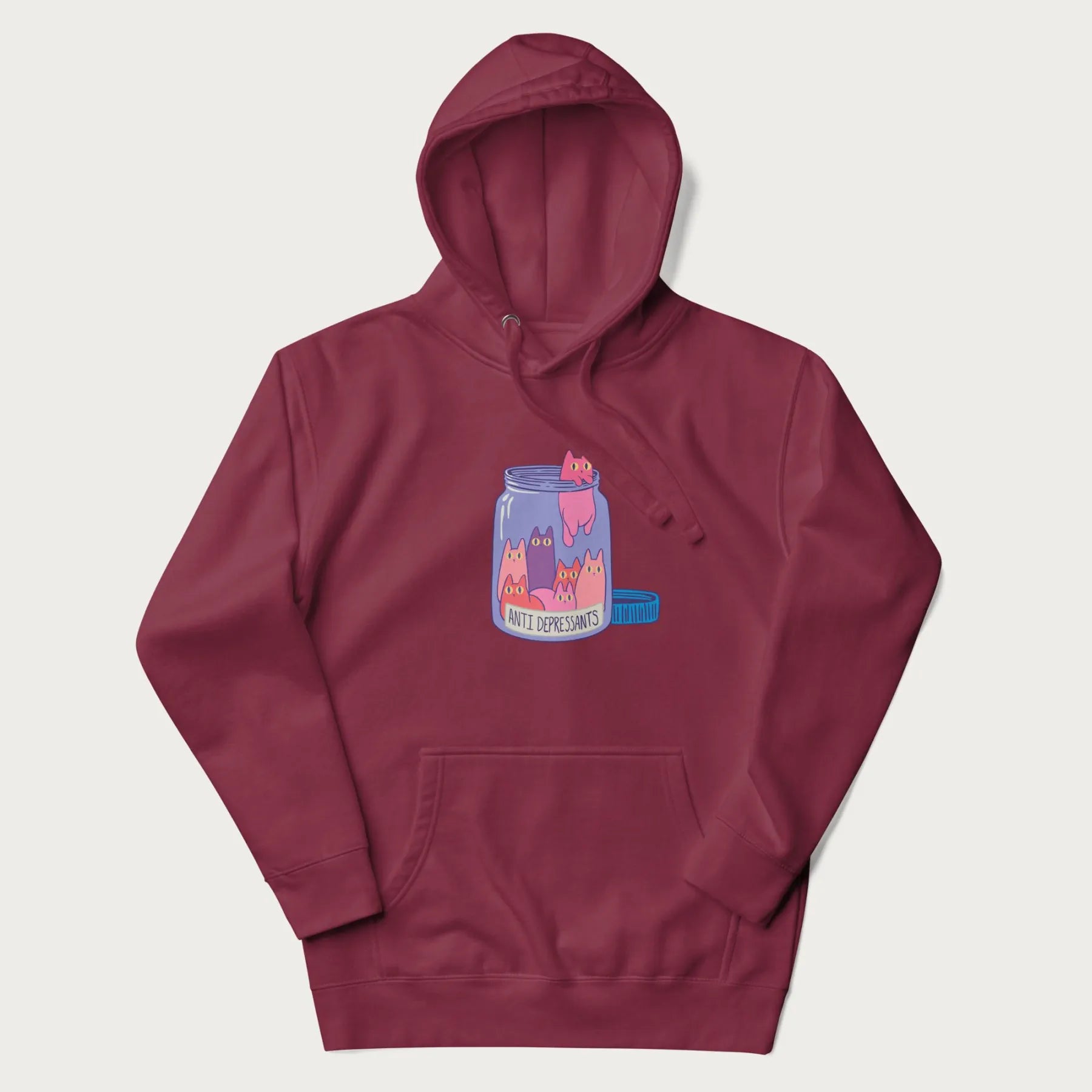 Cartoon cats in a clear jar labeled 'Anti Depressants' printed on a maroon hoodie.