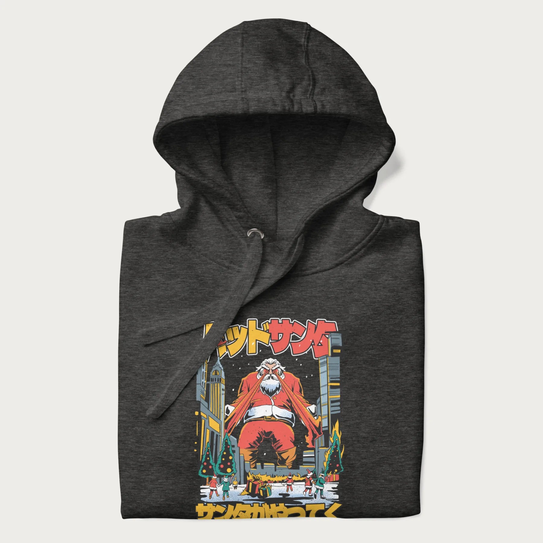 Folded dark grey hoodie with Japanese graphic of Santa Claus with laser eyes attacking a festive city, with the Japanese text 'パッドサンタ' (Bad Santa).