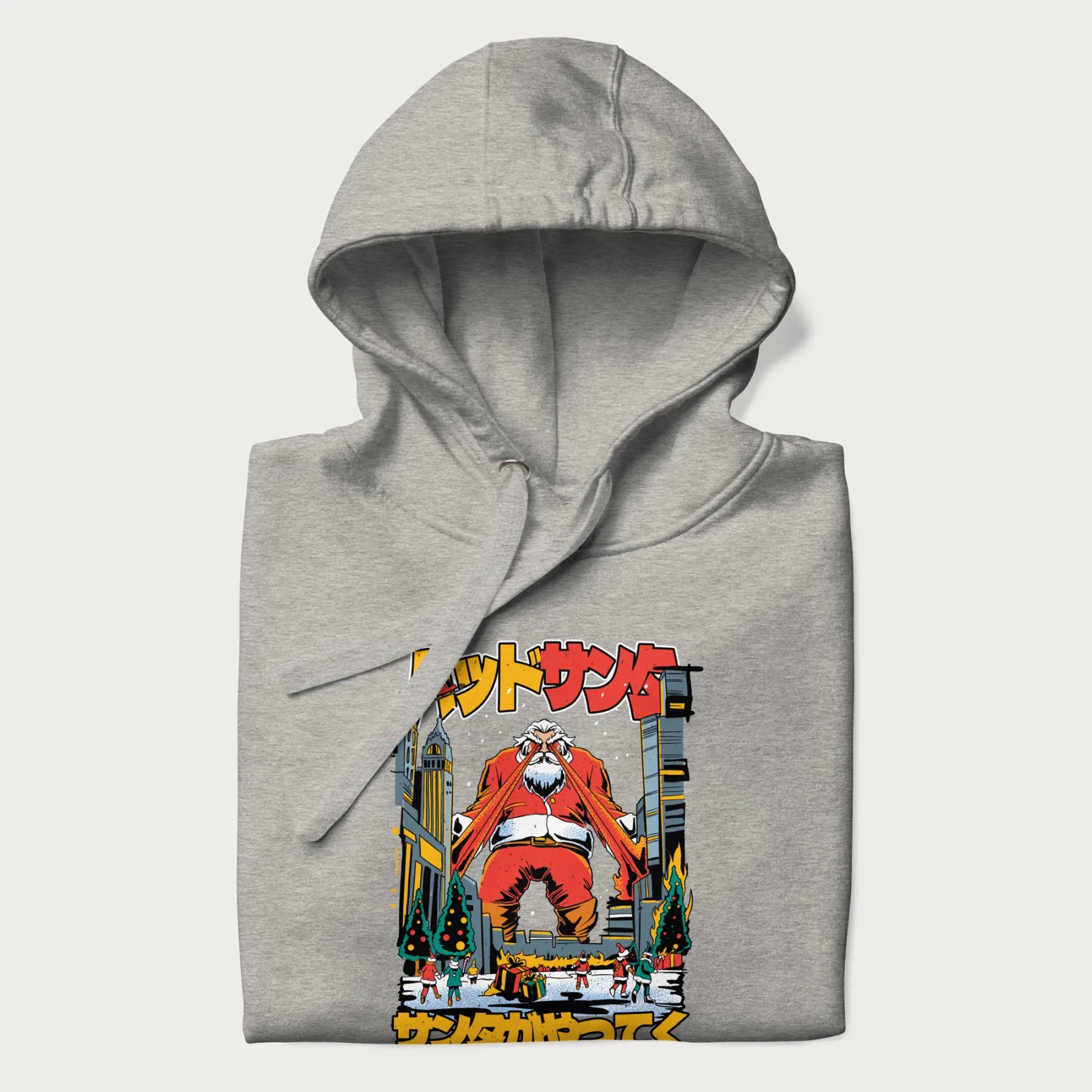 Folded light grey hoodie with Japanese graphic of Santa Claus with laser eyes attacking a festive city, with the Japanese text 'パッドサンタ' (Bad Santa).