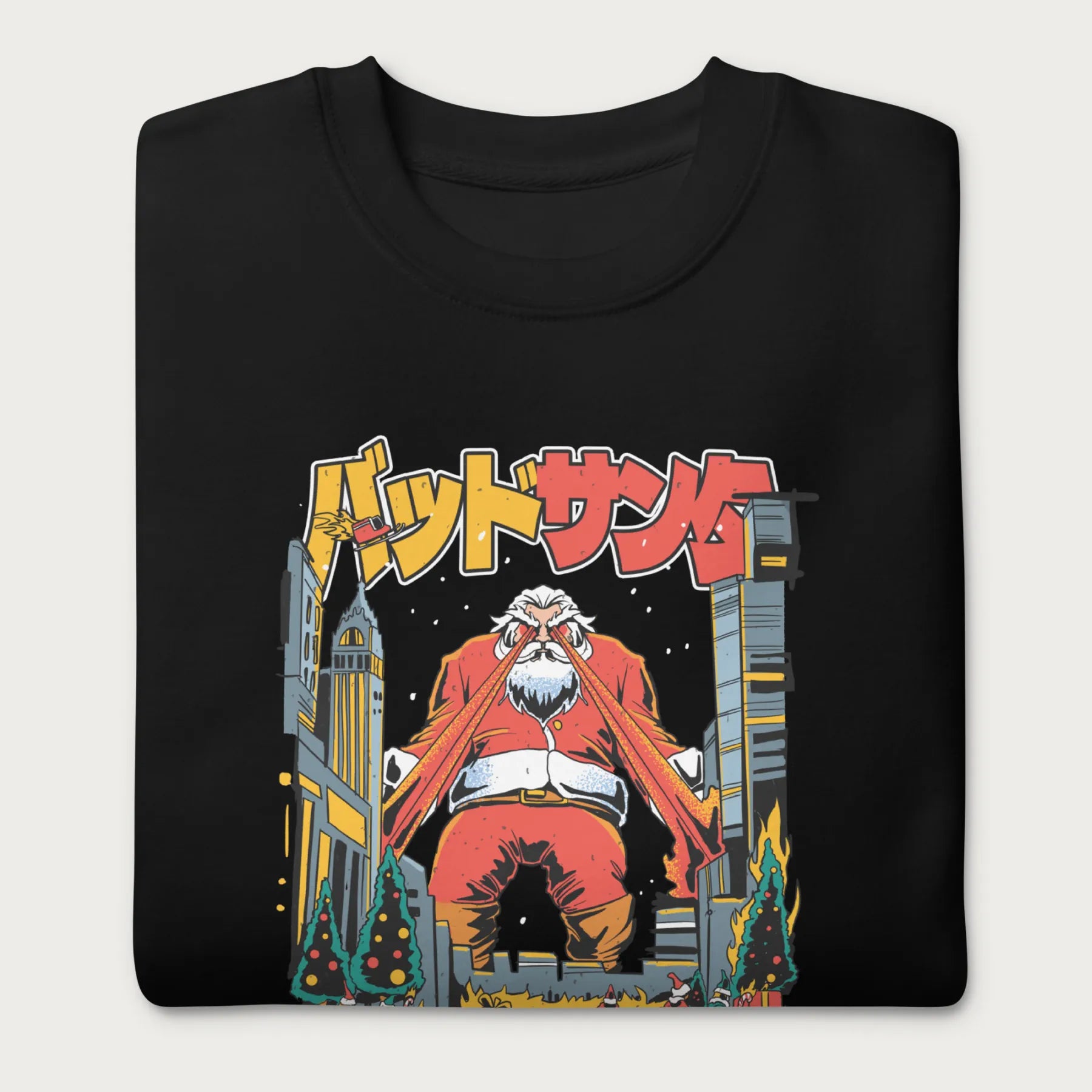 Folded black sweatshirt with a bold graphic of Santa Claus with laser eyes attacking a city, featuring bold Japanese text.
