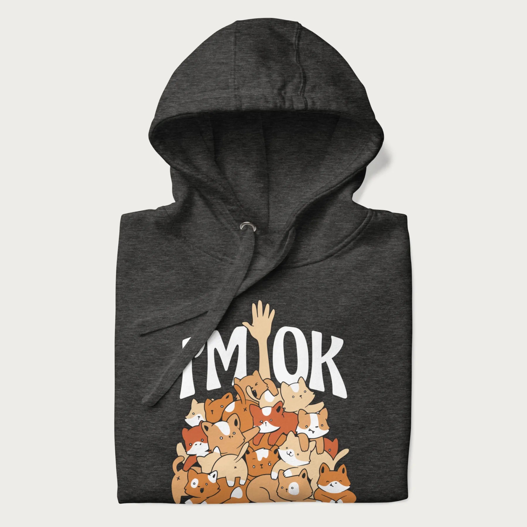 Folded dark grey hoodie with a graphic of kittens piled on top of a person with "I'M OK" in large letters.