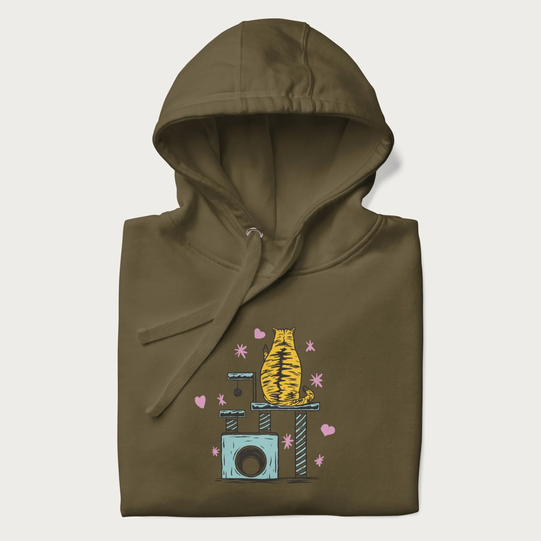 Folded military green hoodie with graphic of a tabby cat on a scratching post, raising its middle finger.