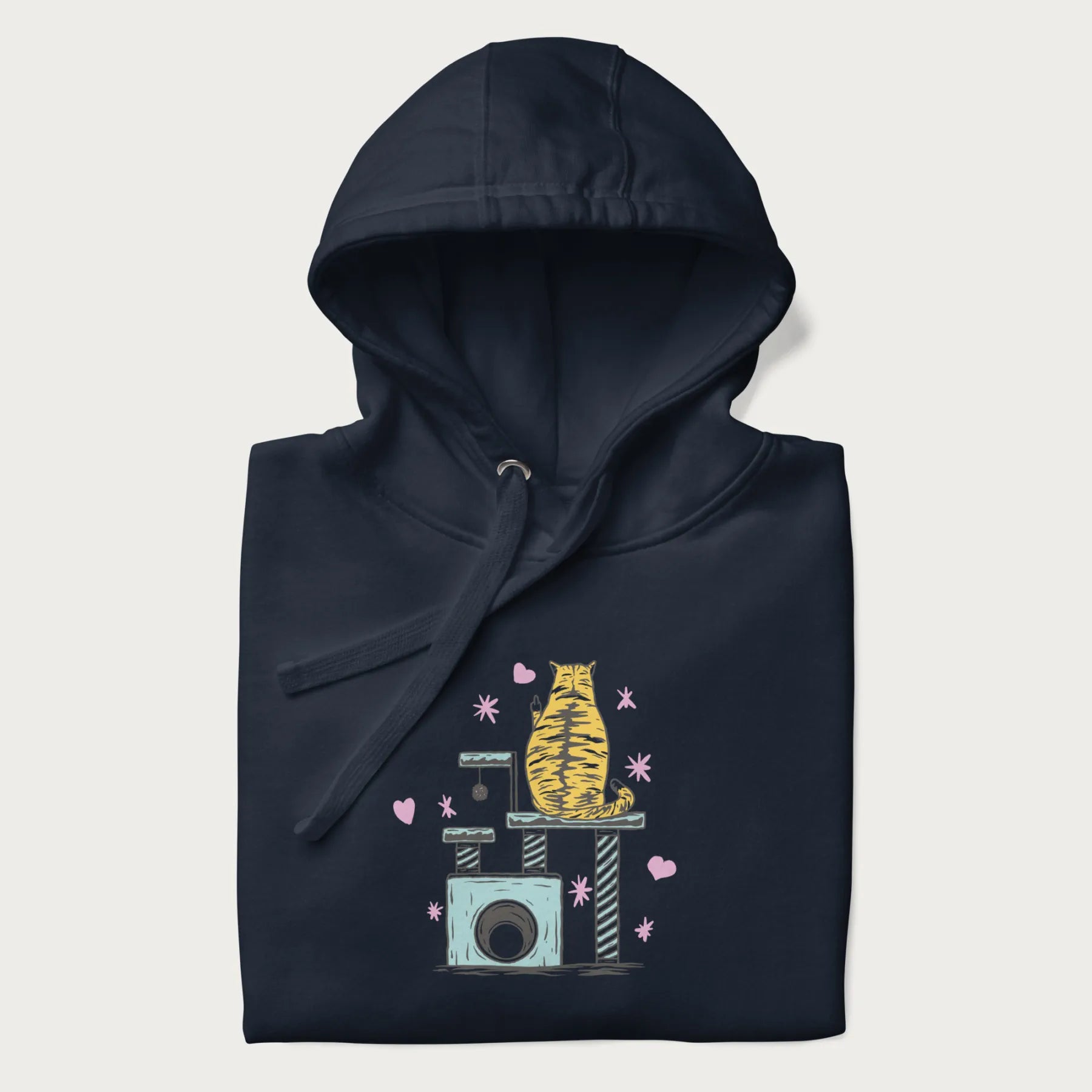 Folded navy blue hoodie with graphic of a tabby cat on a scratching post, raising its middle finger.