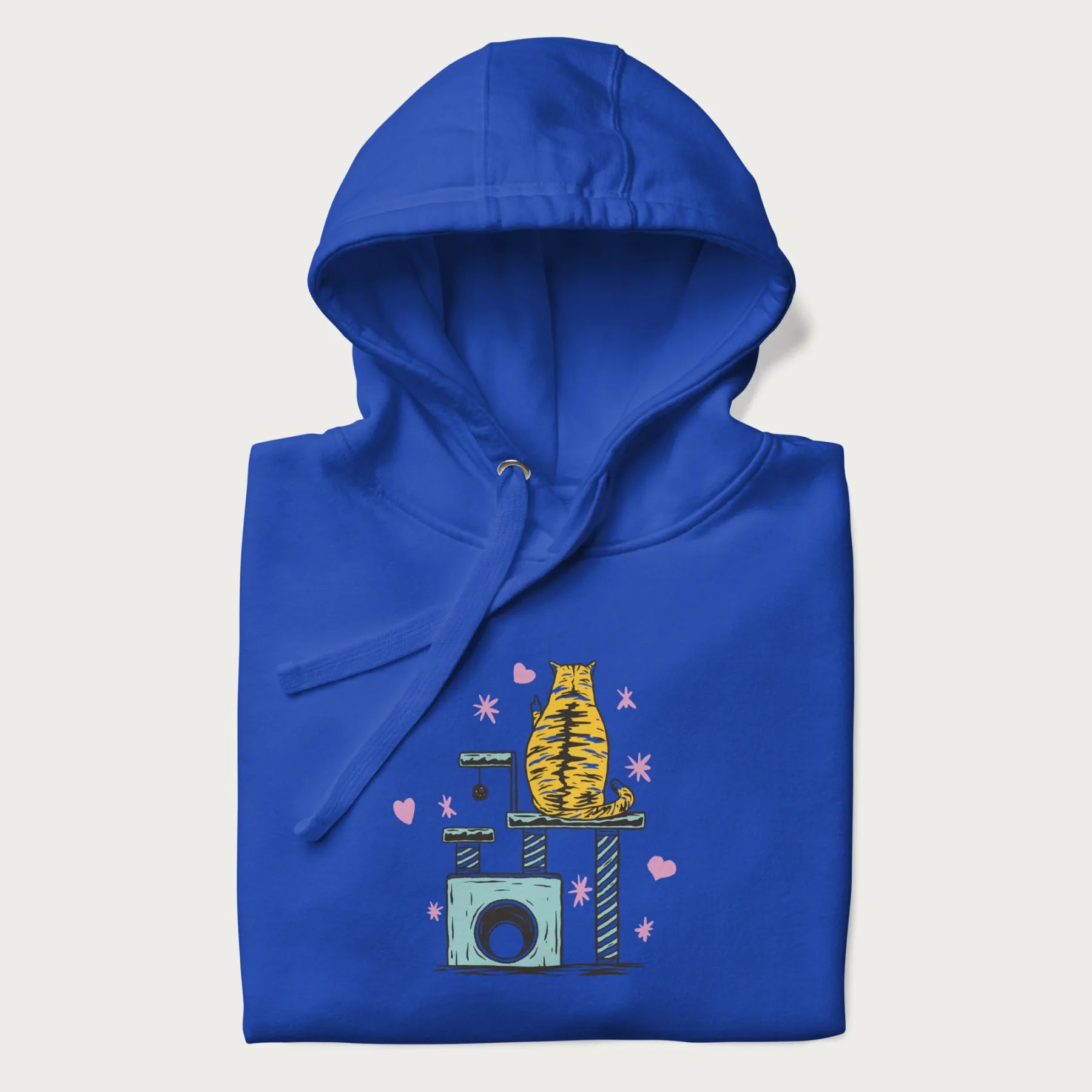 Folded royal blue hoodie with graphic of a tabby cat on a scratching post, raising its middle finger.