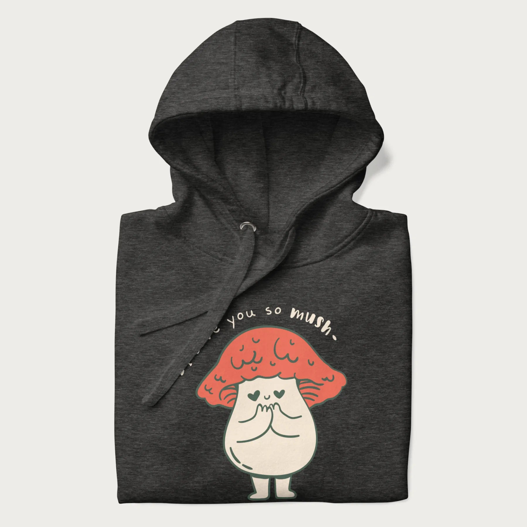 Folded dark grey hoodie with a graphic of a cute mushroom character with a red cap and heart-shaped eyes, and the text 'I Love You So Mush'.
