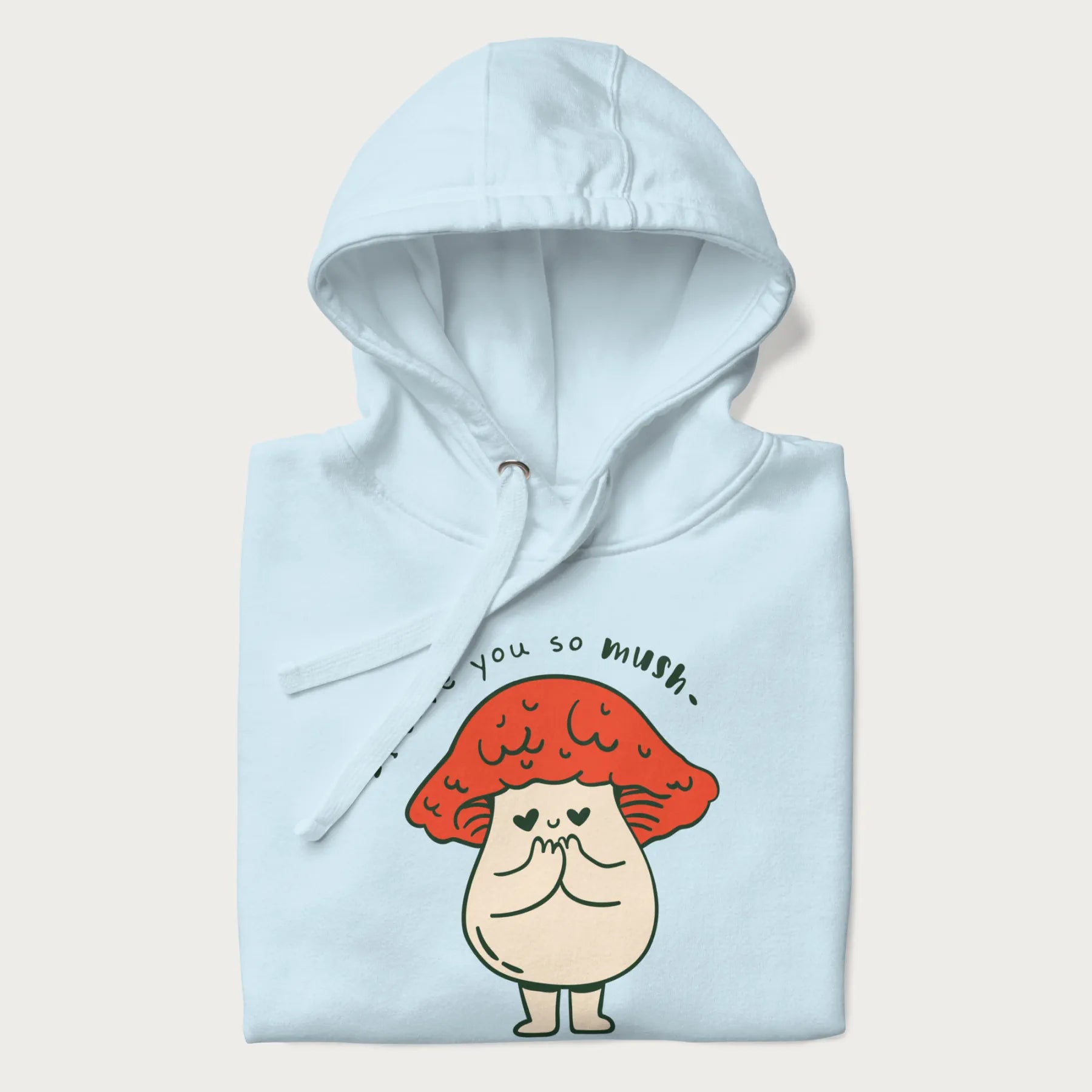 Folded light blue hoodie with a graphic of a cute mushroom character with a red cap and heart-shaped eyes, and the text 'I Love You So Mush'.