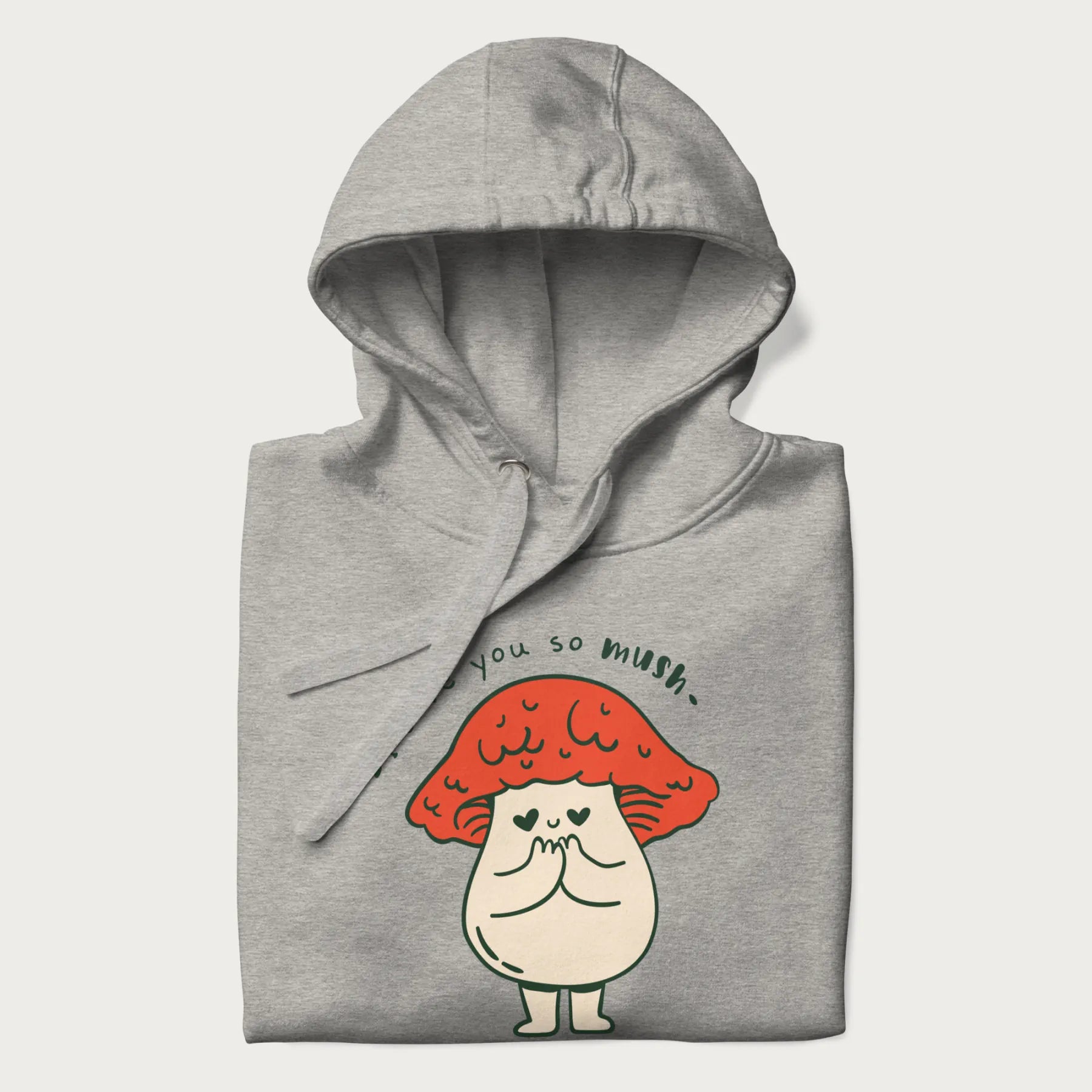 Folded light grey hoodie with a graphic of a cute mushroom character with a red cap and heart-shaped eyes, and the text 'I Love You So Mush'.