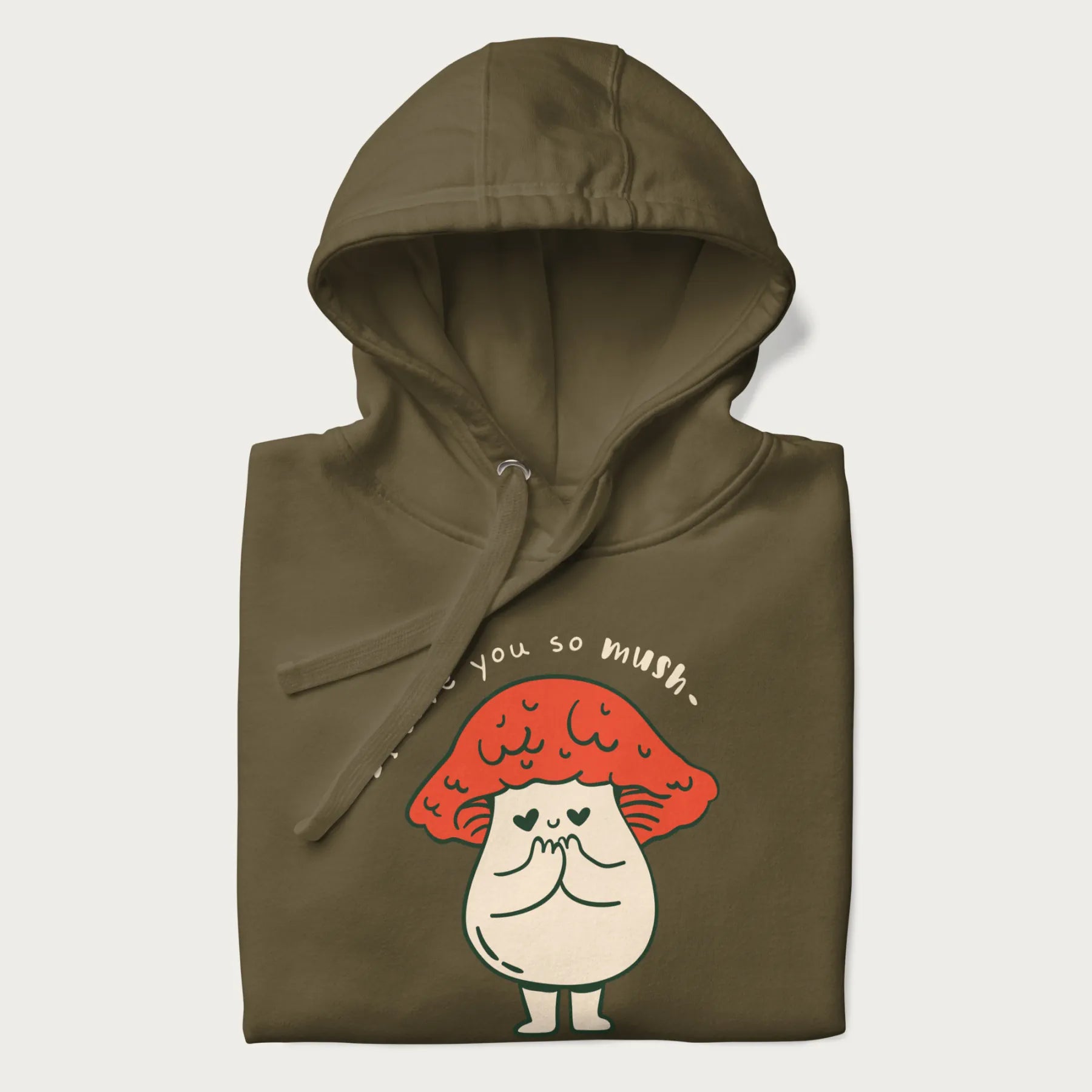 Folded military green hoodie with a graphic of a cute mushroom character with a red cap and heart-shaped eyes, and the text 'I Love You So Mush'.