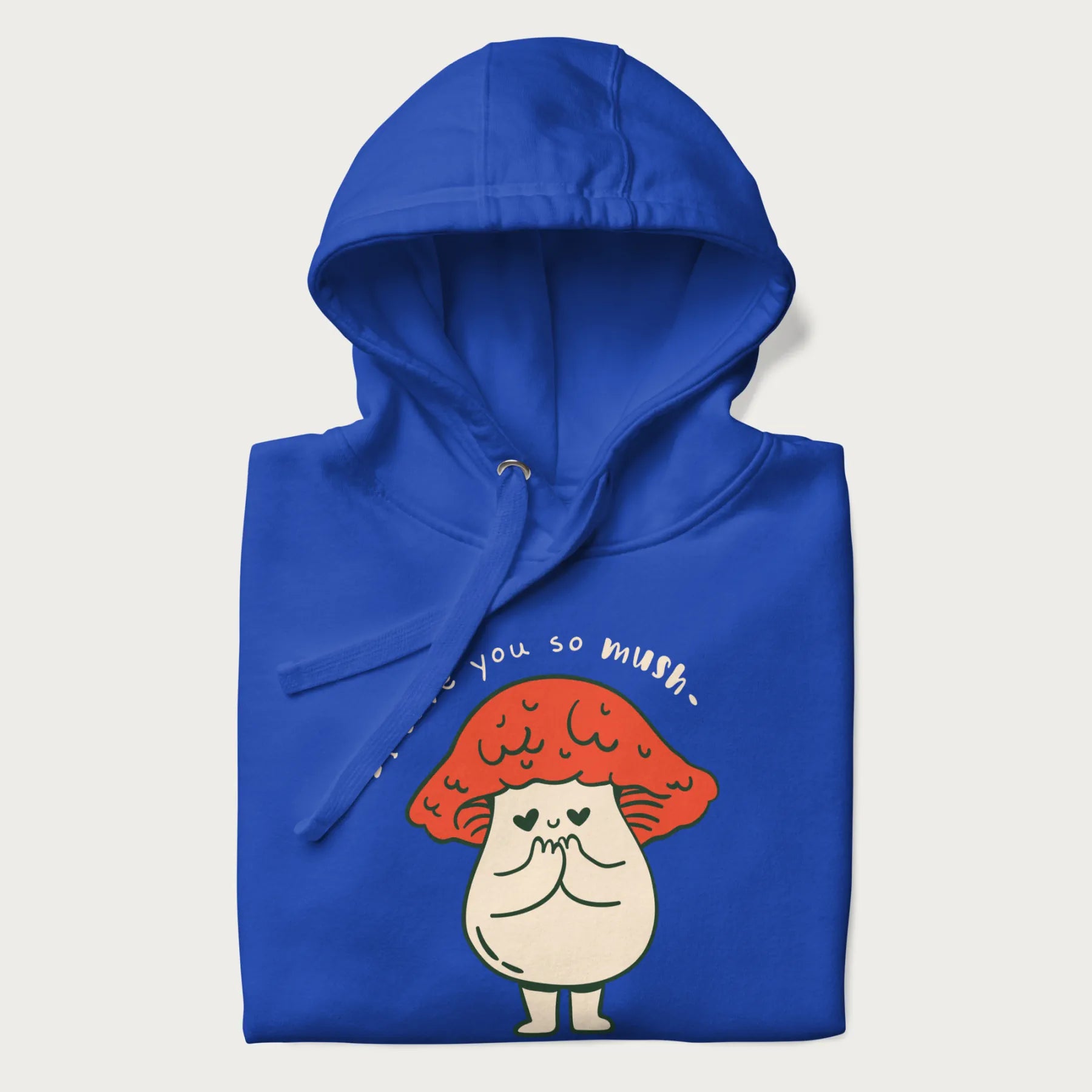 Folded royal blue hoodie with a graphic of a cute mushroom character with a red cap and heart-shaped eyes, and the text 'I Love You So Mush'.