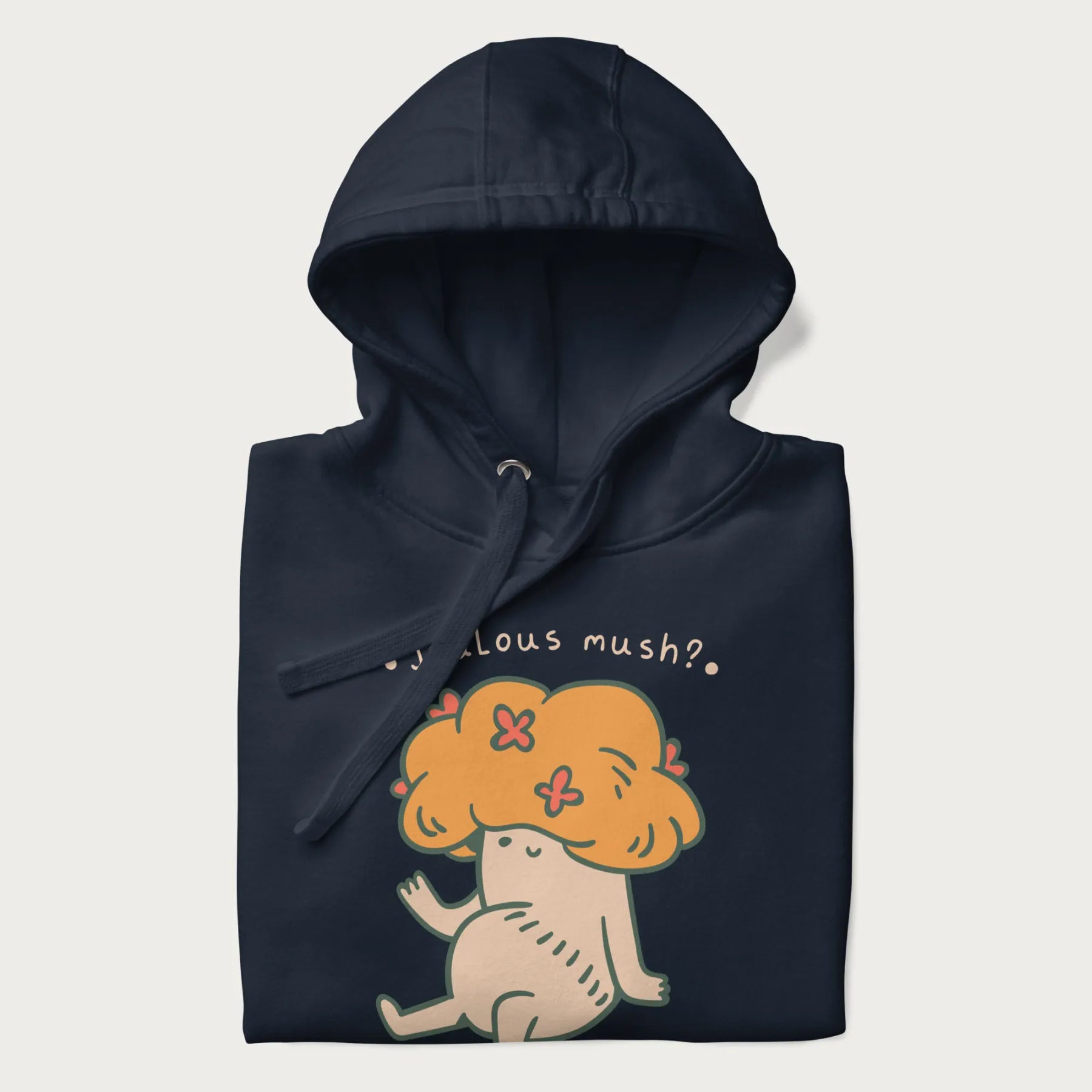 Folded navy blue hoodie with a graphic of a mushroom character with an orange cap and the text 'Jealous mush?'.