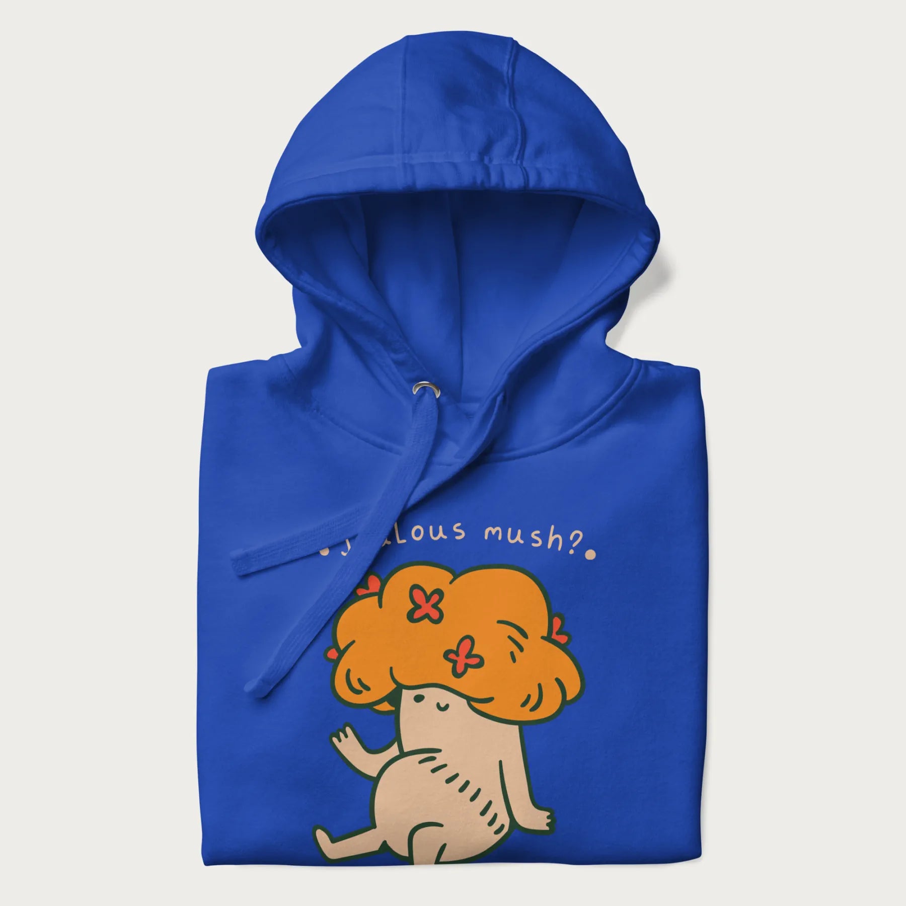 Folded royal blue hoodie with a graphic of a mushroom character with an orange cap and the text 'Jealous mush?'.