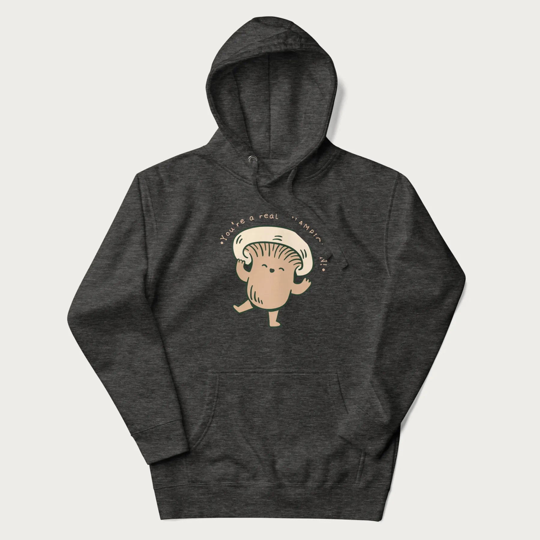 Dark grey hoodie with a graphic of an adorable mushroom character and the text 'You're a real CHAMPIGNON!'.