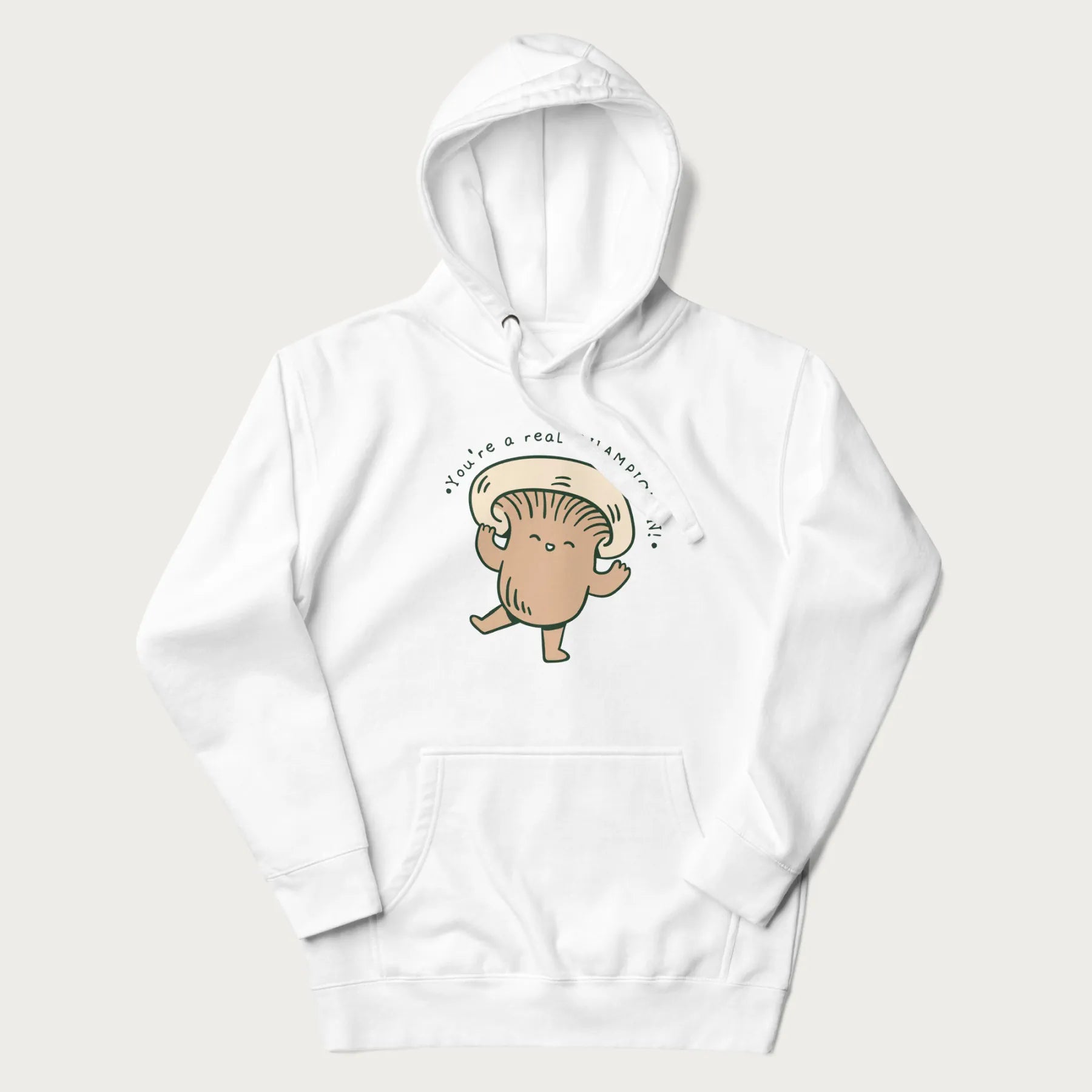 White hoodie with a graphic of an adorable mushroom character and the text 'You're a real CHAMPIGNON!'.