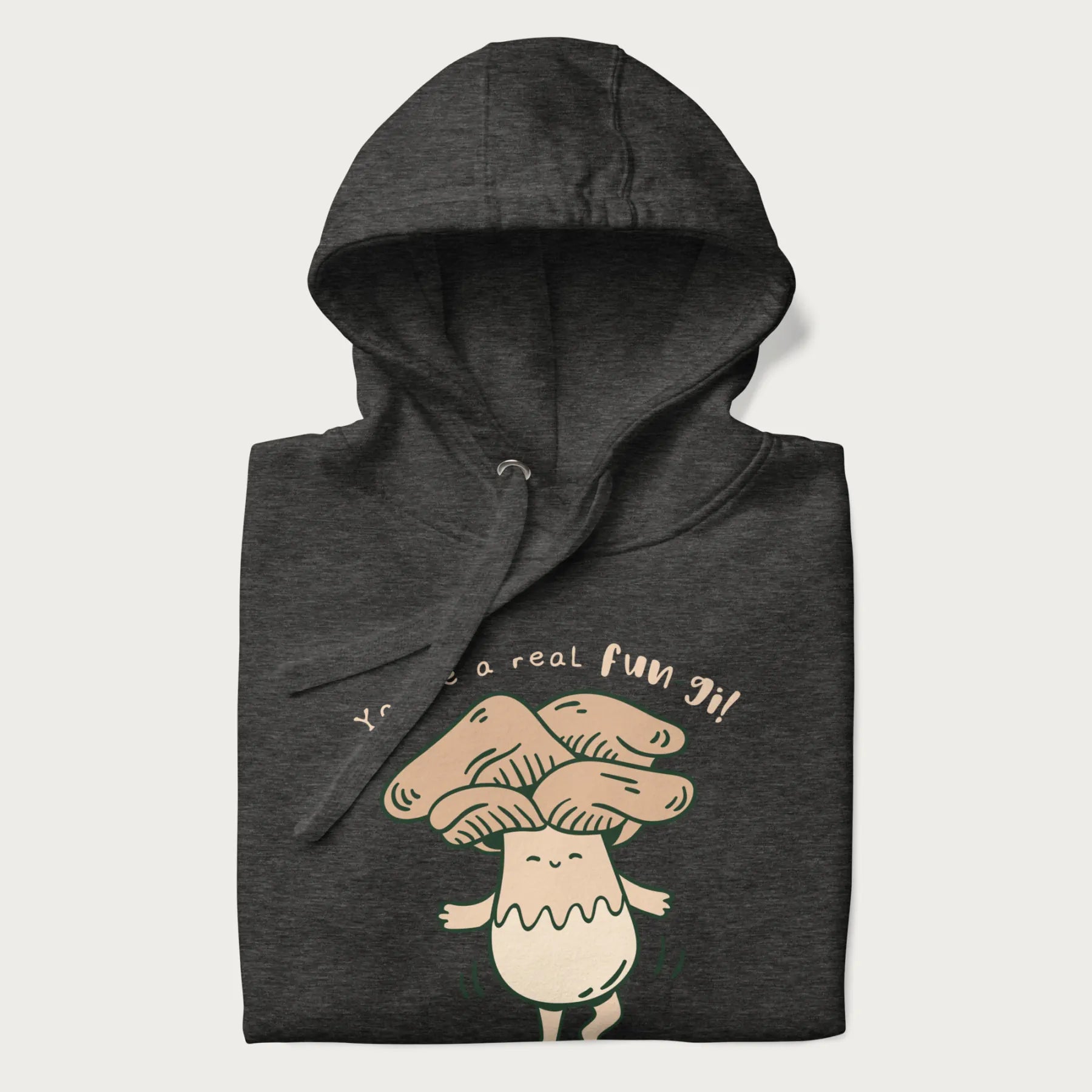 Folded dark grey hoodie with a graphic of a happy mushroom character and the text 'You're a real fun-gi!'.