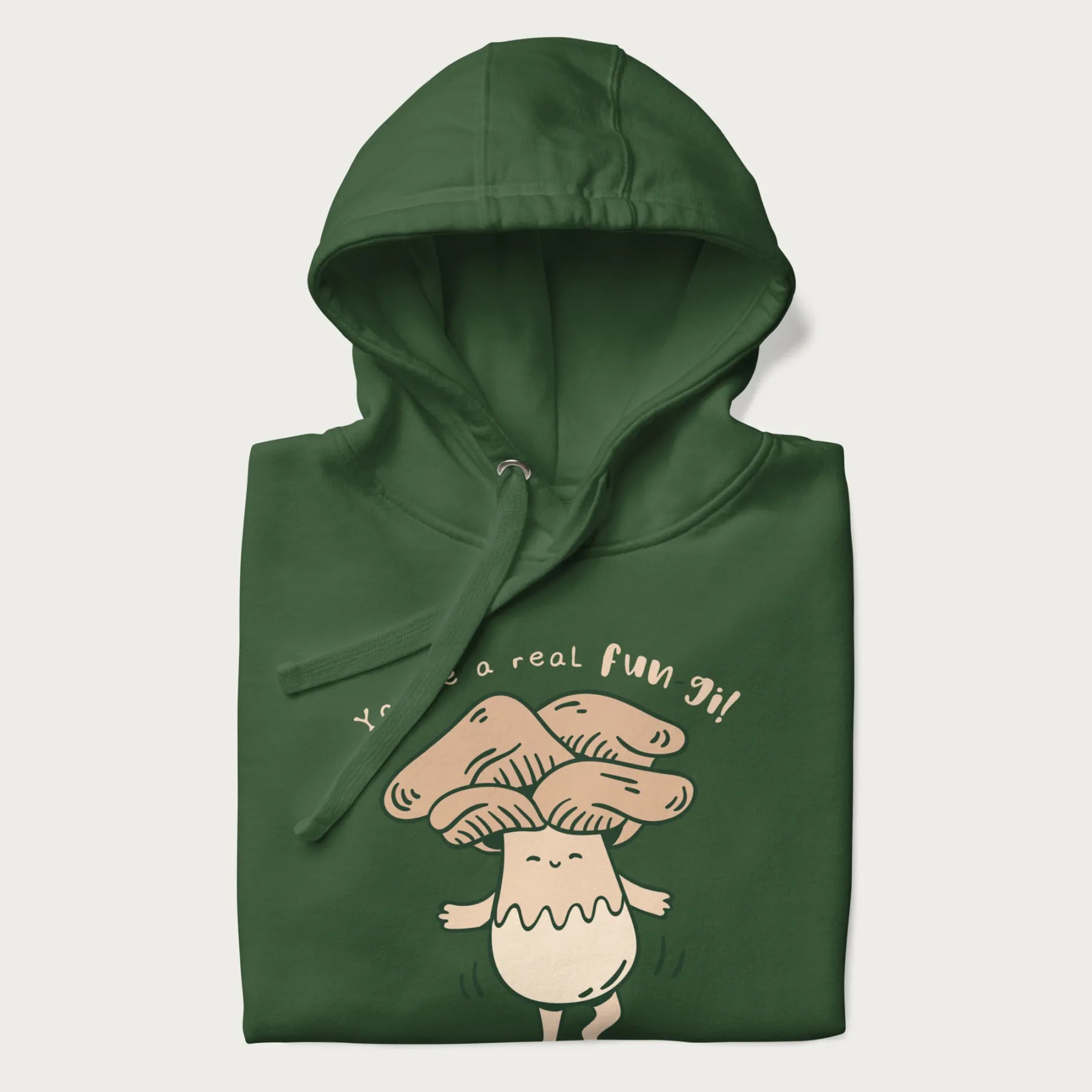 Folded forest green hoodie with a graphic of a happy mushroom character and the text 'You're a real fun-gi!'.