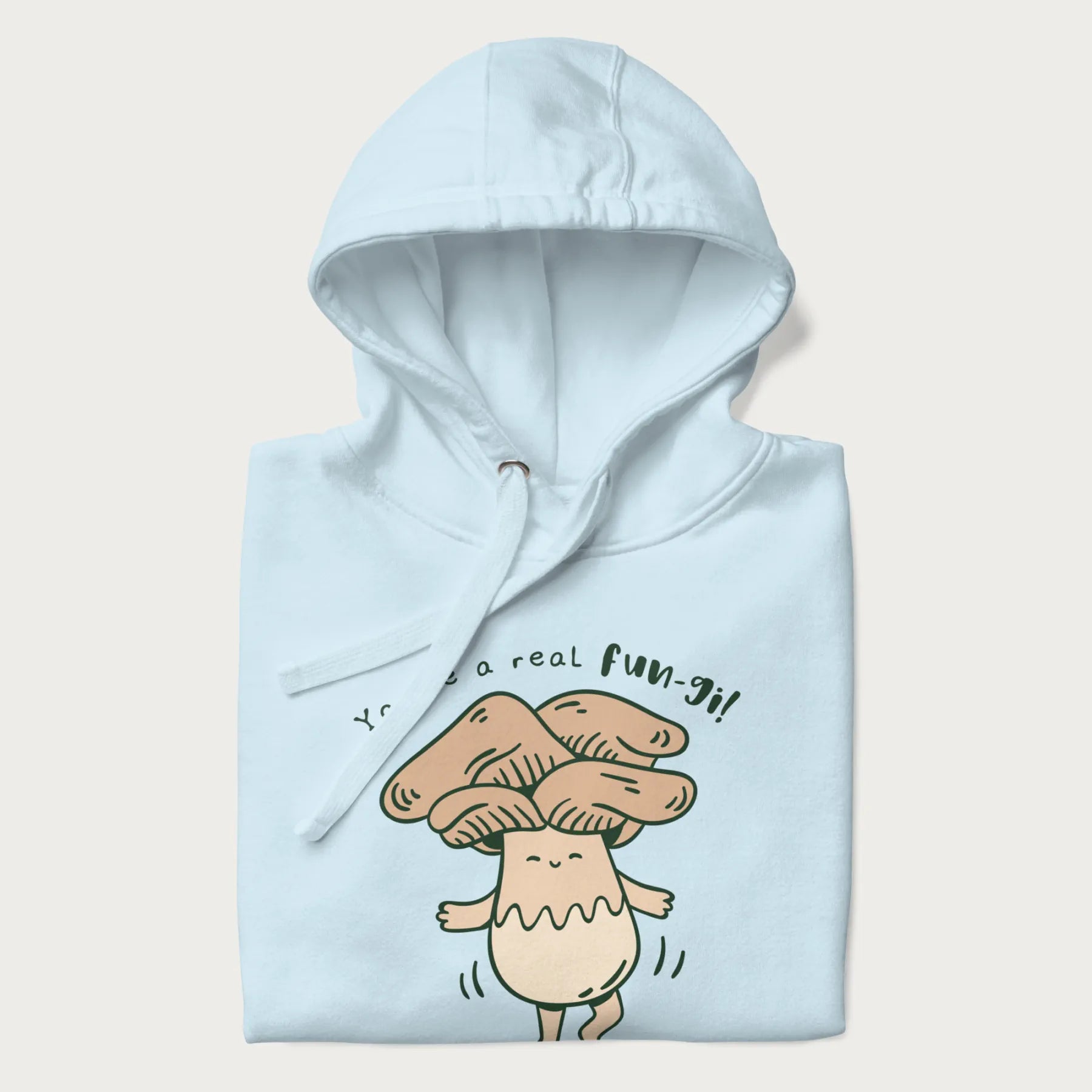 Folded light blue hoodie with a graphic of a happy mushroom character and the text 'You're a real fun-gi!'.