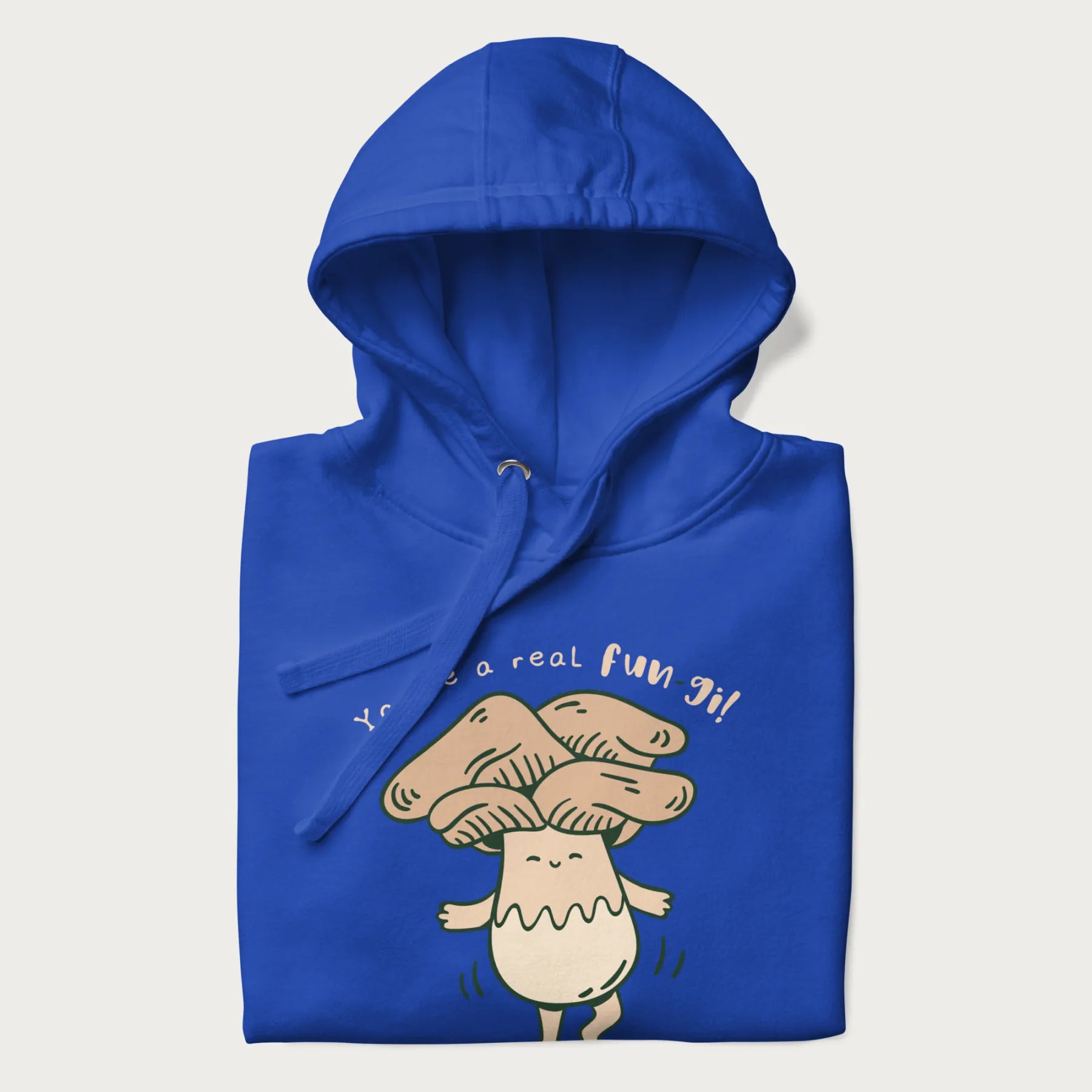 Folded royal blue hoodie with a graphic of a happy mushroom character and the text 'You're a real fun-gi!'.