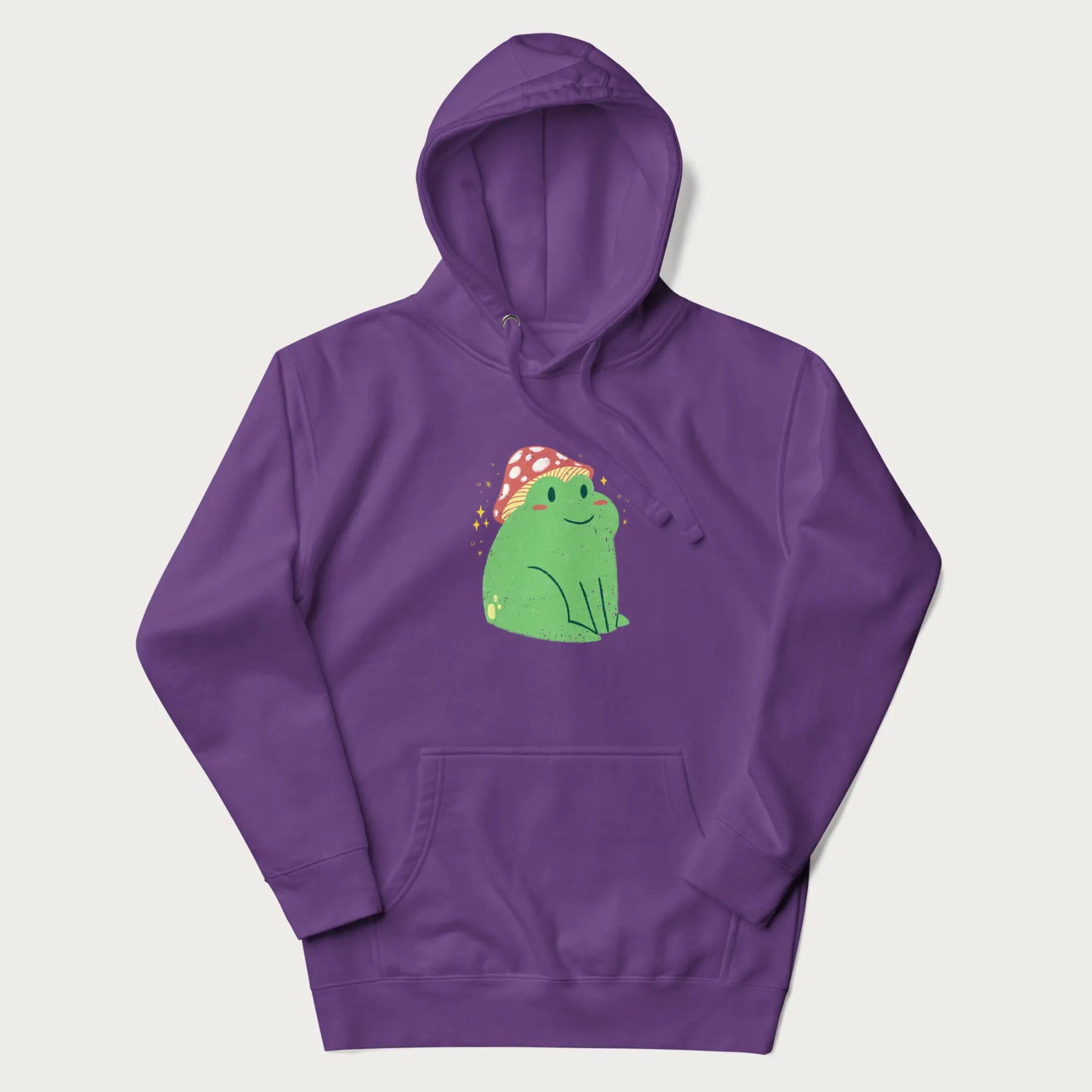 Purple hoodie with a graphic of a green frog wearing a mushroom cap surrounded by stars.