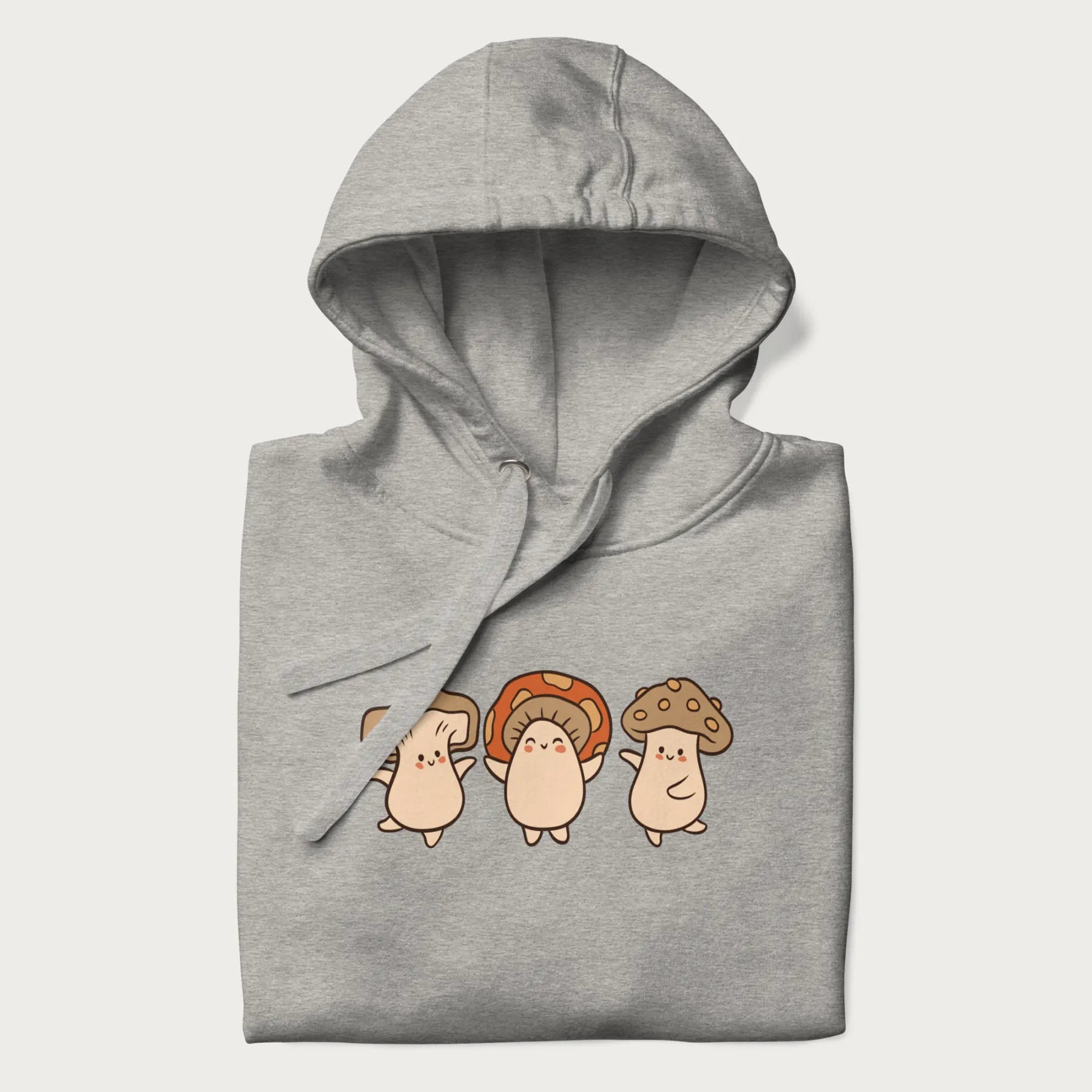 Folded light grey hoodie with a graphic illustration of three cheerful dancing mushrooms.