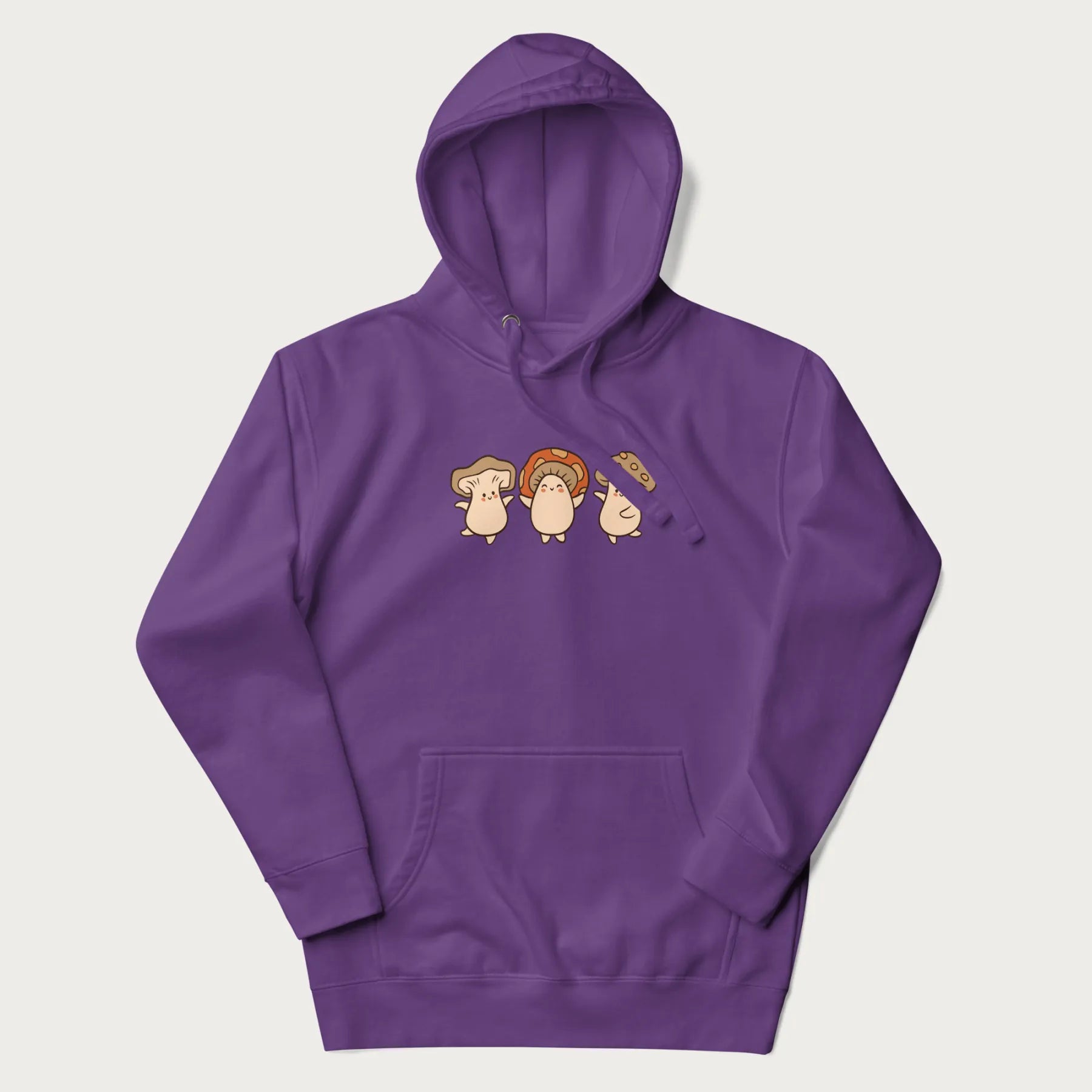 Purple hoodie with a graphic illustration of three cheerful dancing mushrooms.
