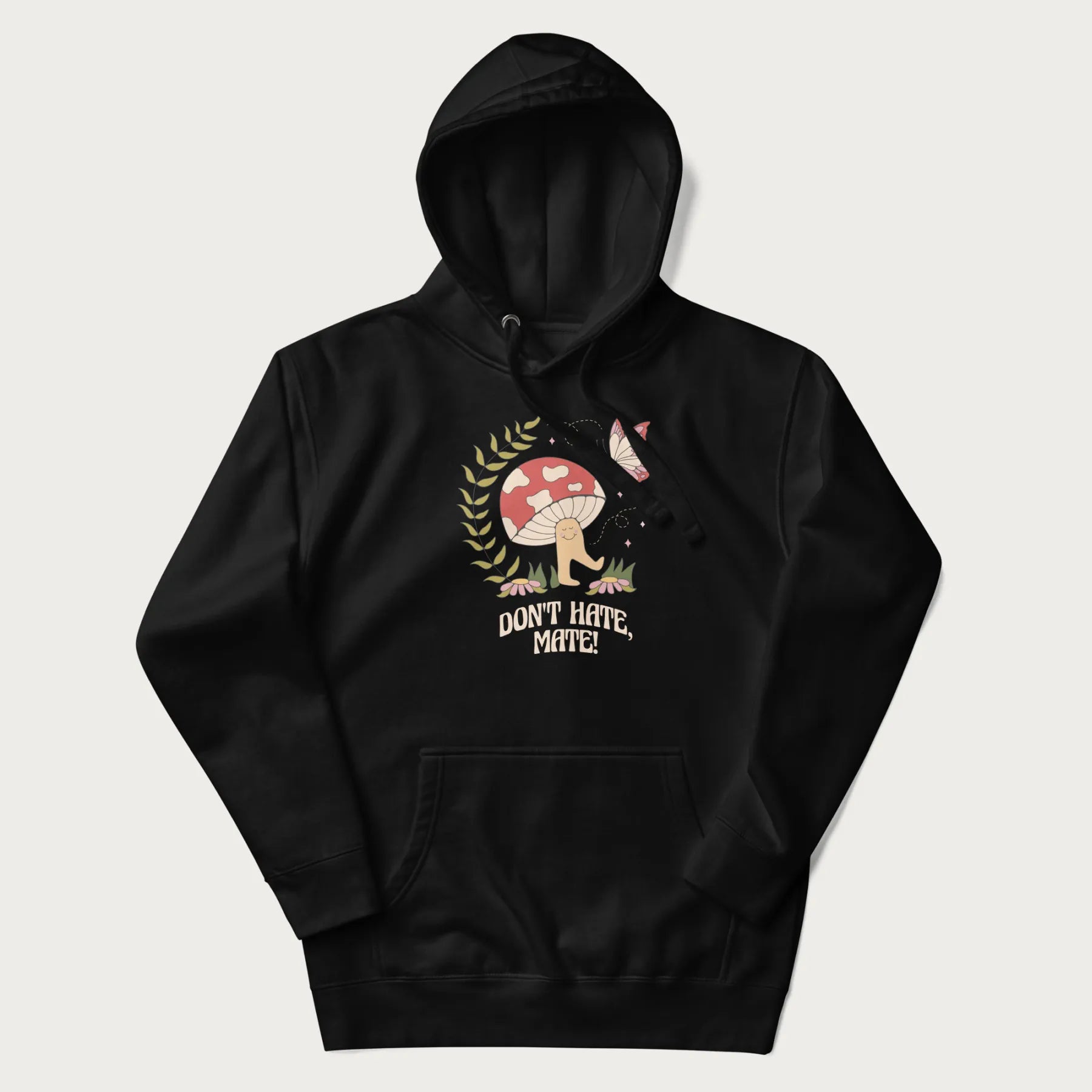 Black hoodie featuring a cute mushroom graphic with the text "Don't Hate, Mate."