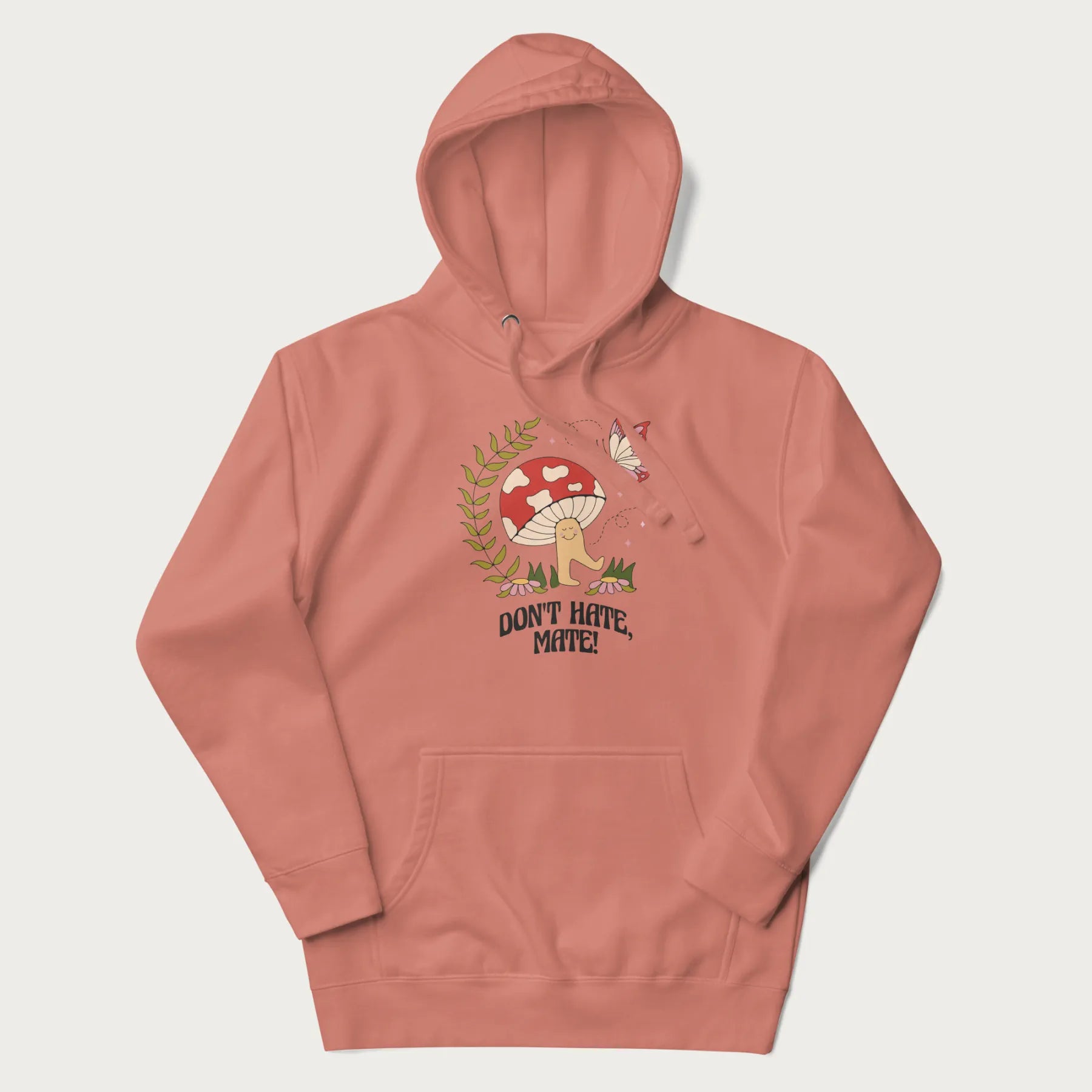 Light pink hoodie featuring a cute mushroom graphic with the text "Don't Hate, Mate."