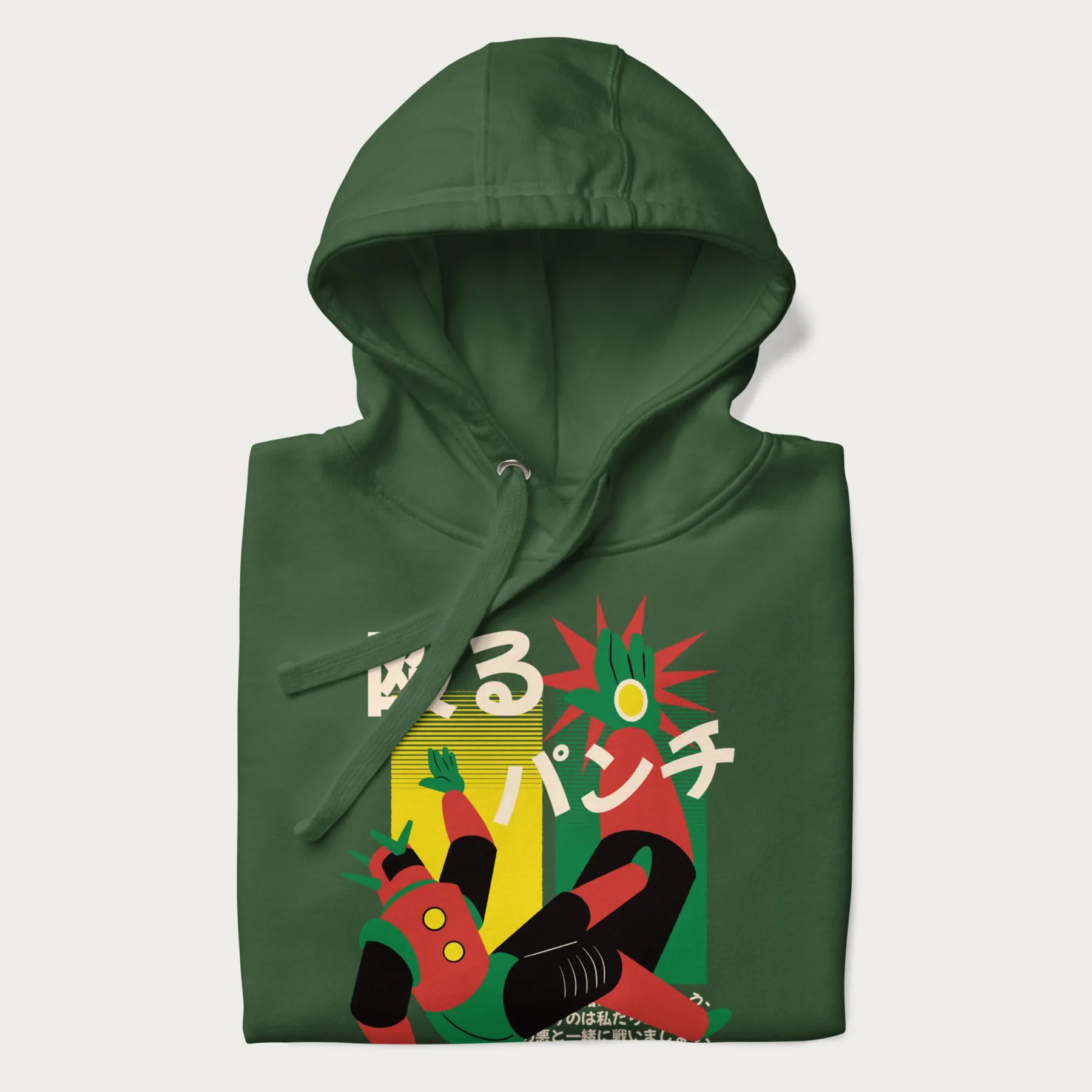 Folded forest green hoodie with Japanese graphic of a mech warrior in mid-battle, highlighted by Japanese text and dynamic retro color palette.
