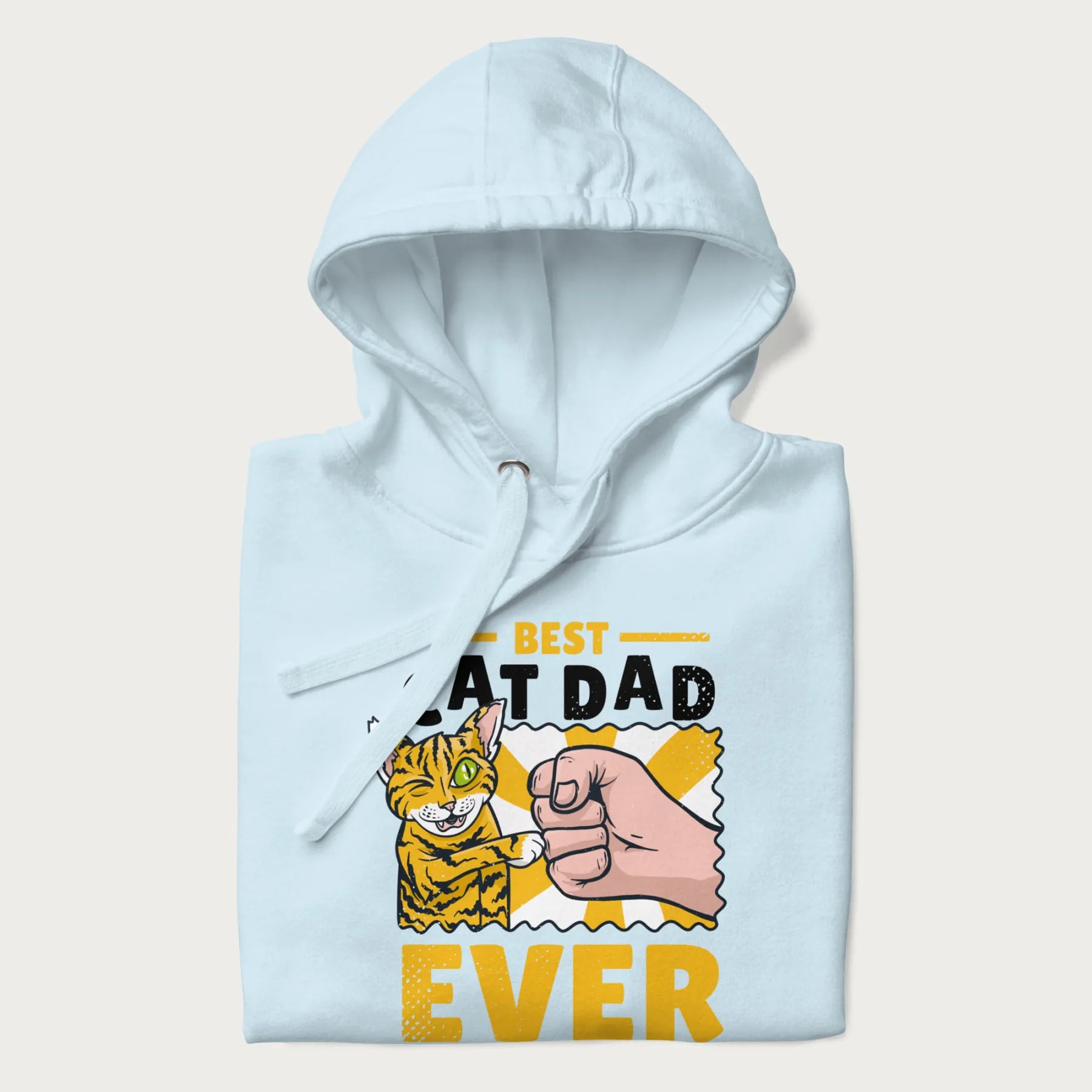 Folded light blue hoodie with a graphic of a tabby cat and a human fist bumping, with 'Best Cat Dad Ever' in bold letters.
