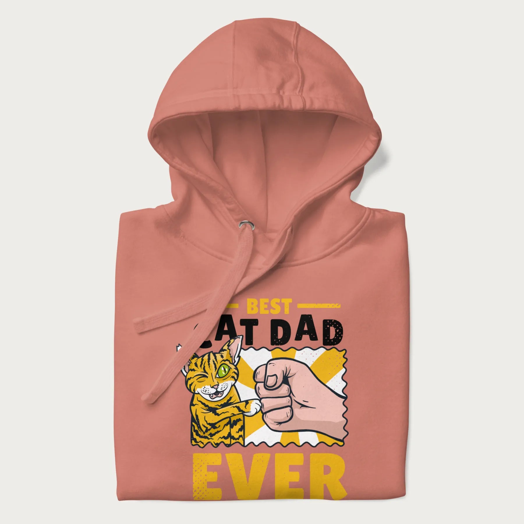 Folded light pink hoodie with a graphic of a tabby cat and a human fist bumping, with 'Best Cat Dad Ever' in bold letters.