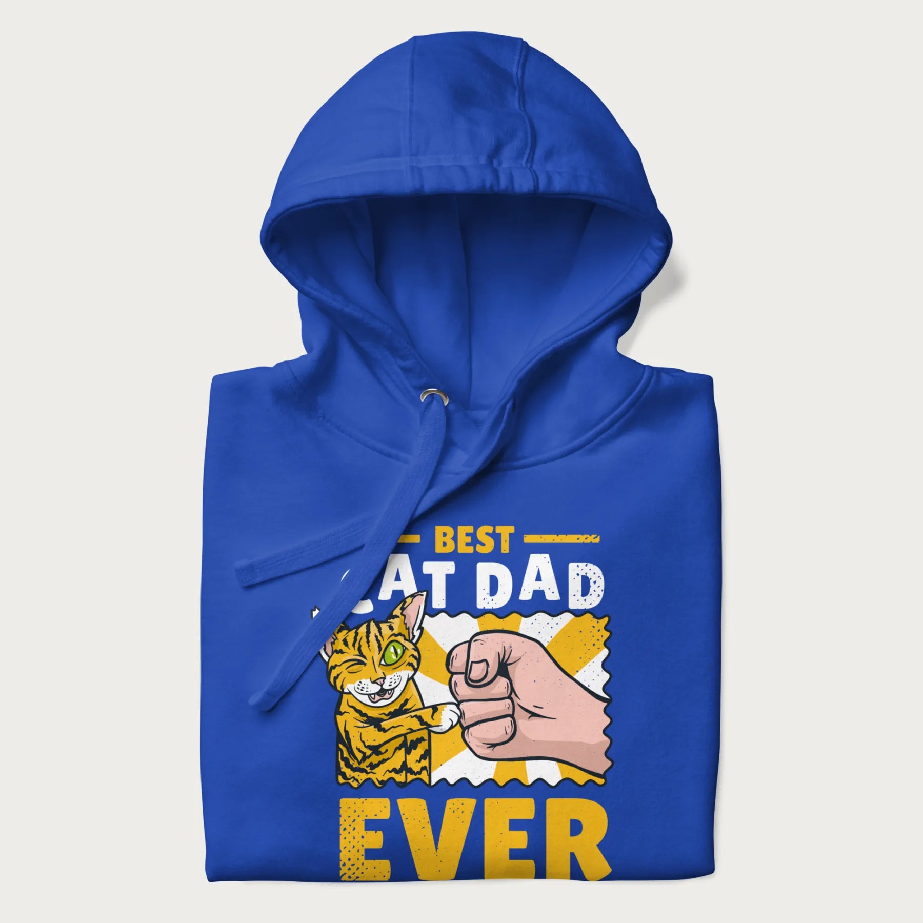 Folded royal blue hoodie with a graphic of a tabby cat and a human fist bumping, with 'Best Cat Dad Ever' in bold letters.