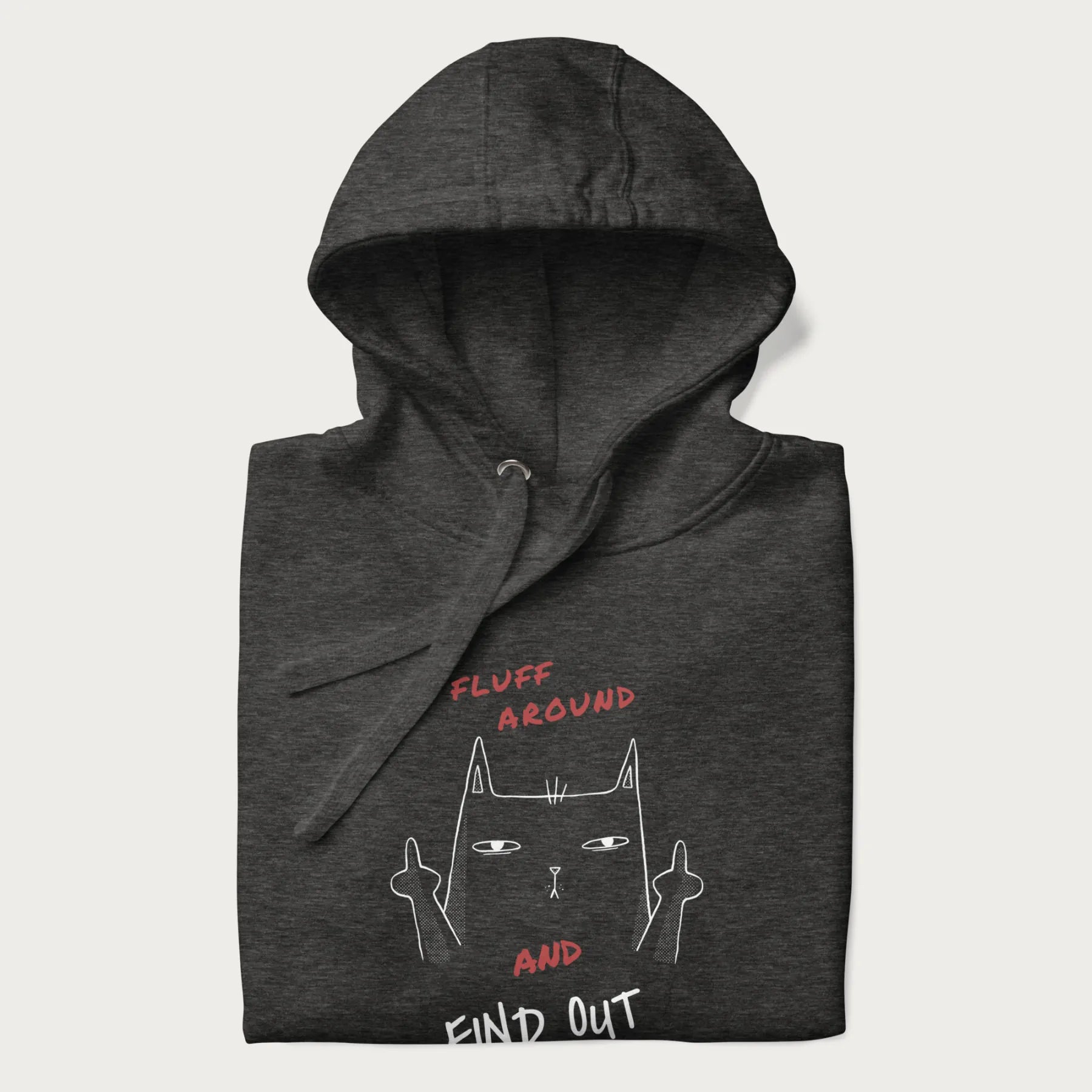 Folded dark grey hoodie with a graphic of a cat raising its middle fingers and the text "FLUFF AROUND AND FIND OUT" in red.