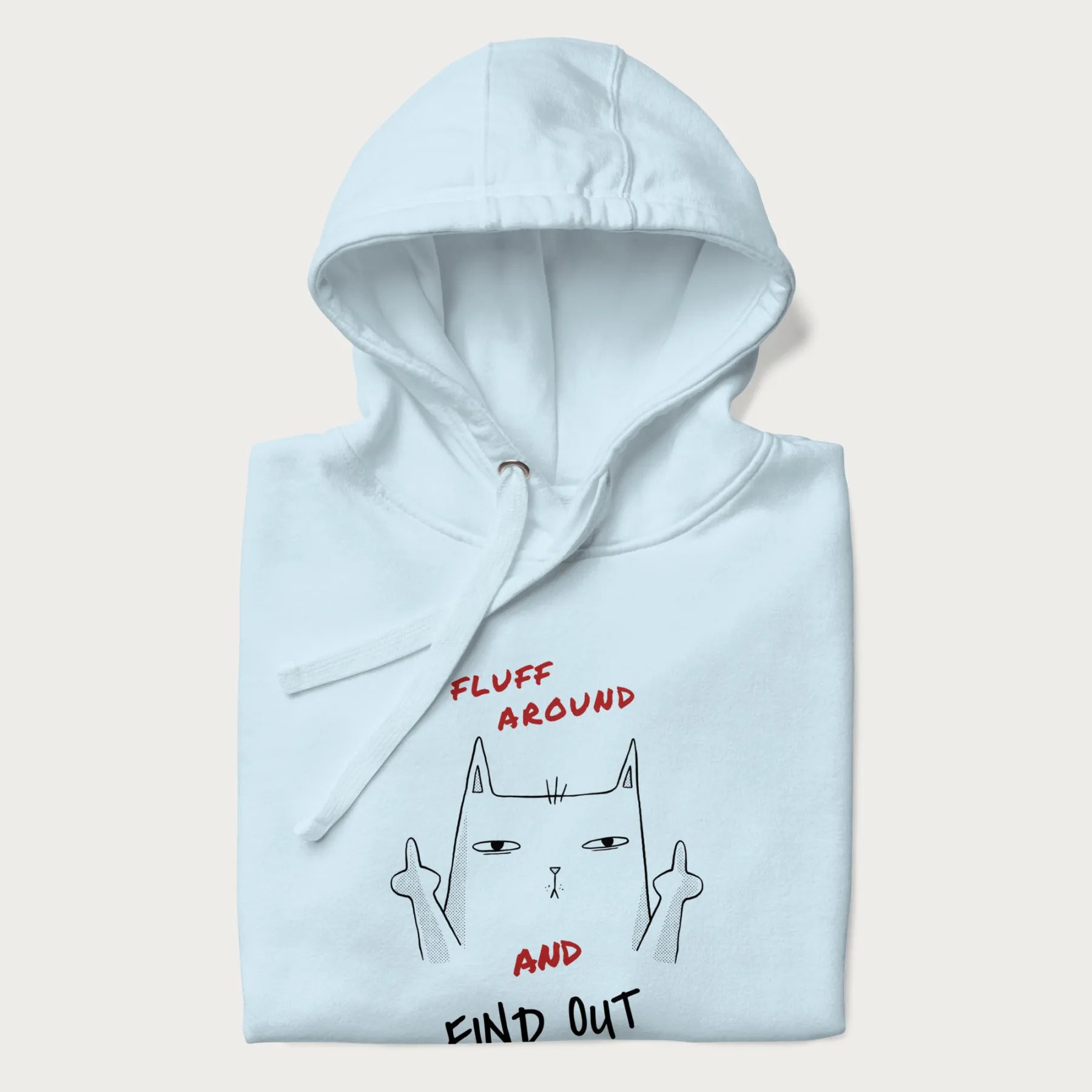 Folded light blue hoodie with a graphic of a cat raising its middle fingers and the text "FLUFF AROUND AND FIND OUT" in red.
