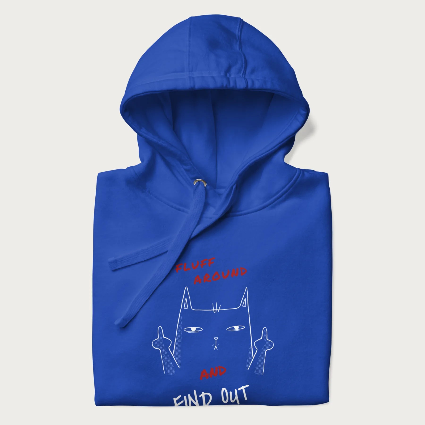 Folded royal blue hoodie with a graphic of a cat raising its middle fingers and the text "FLUFF AROUND AND FIND OUT" in red.