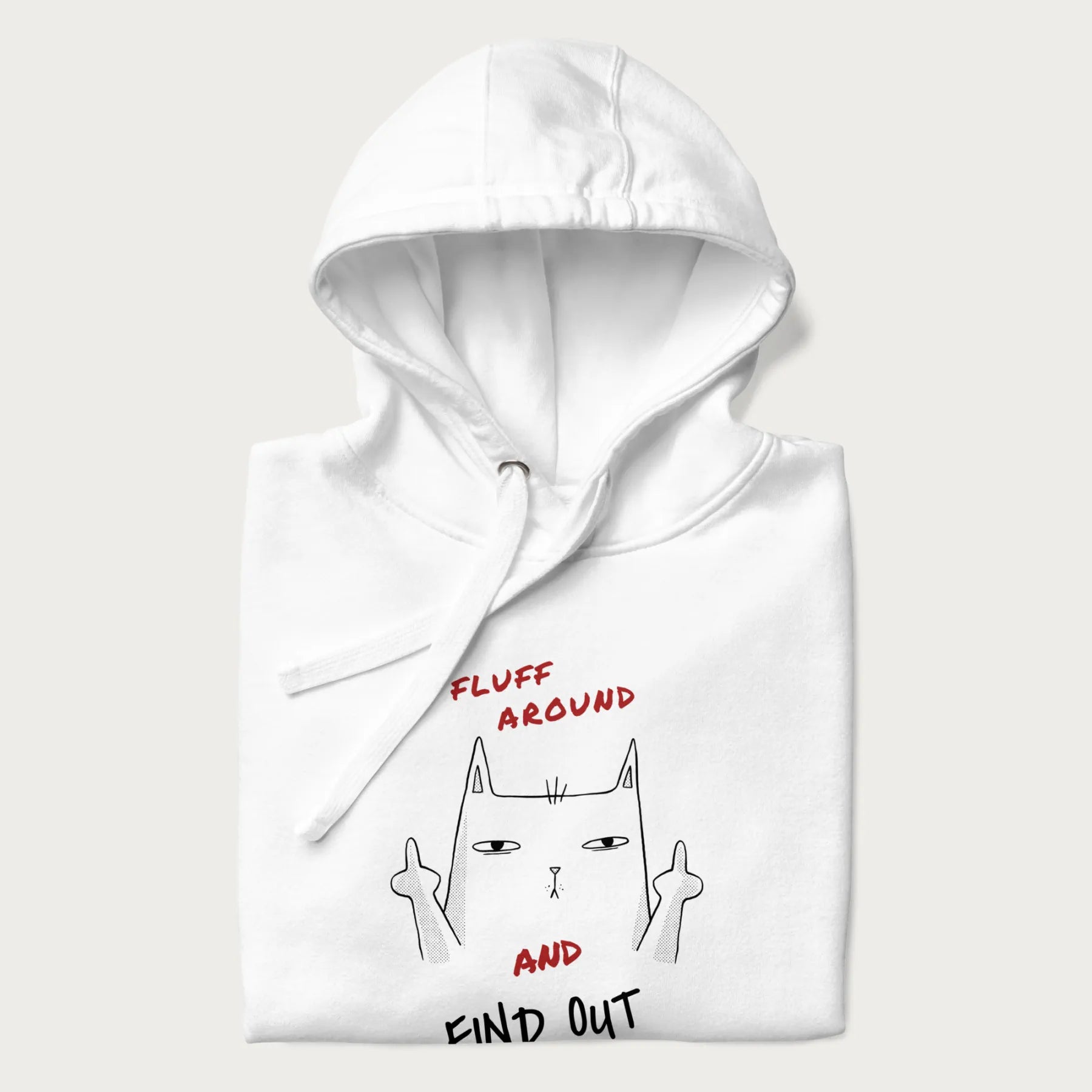 Folded white hoodie with a graphic of a cat raising its middle fingers and the text "FLUFF AROUND AND FIND OUT" in red.