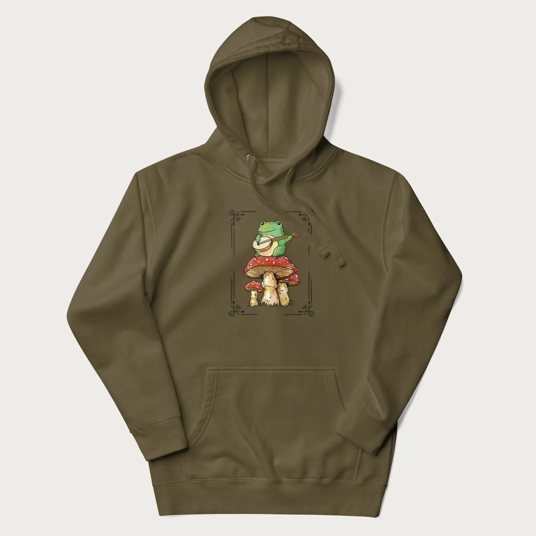 Military green hoodie featuring a graphic of a frog playing a banjo on top of red mushrooms.