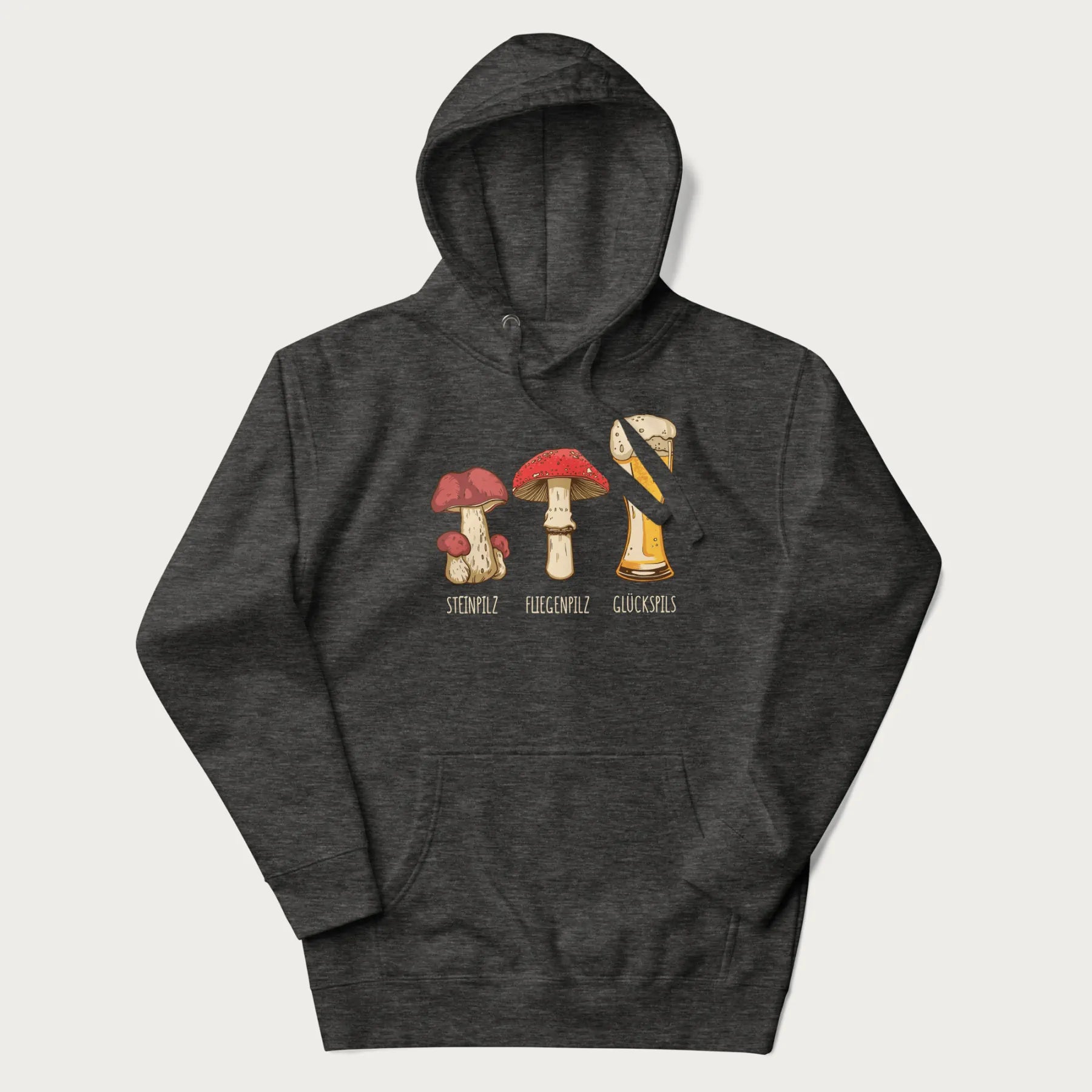 Folded dark grey hoodie with illustrations of a Steinpilz, Fliegenpilz, and a beer glass labeled Glückspils.
