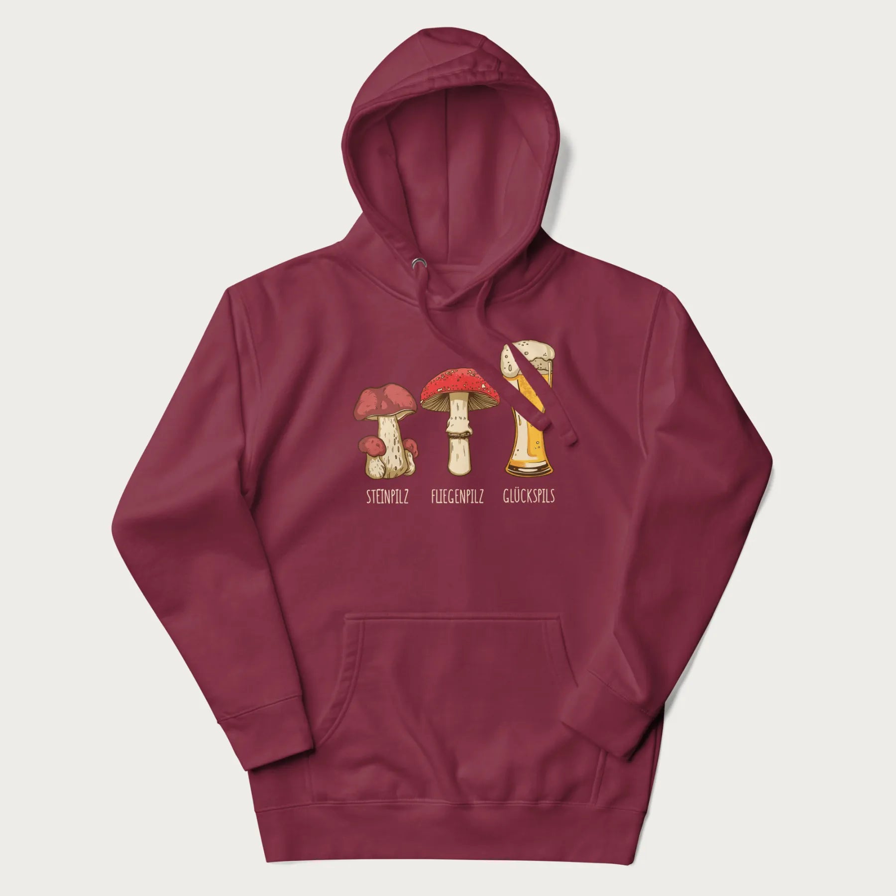 Maroon hoodie with illustrations of a Steinpilz, Fliegenpilz, and a beer glass labeled Glückspils.