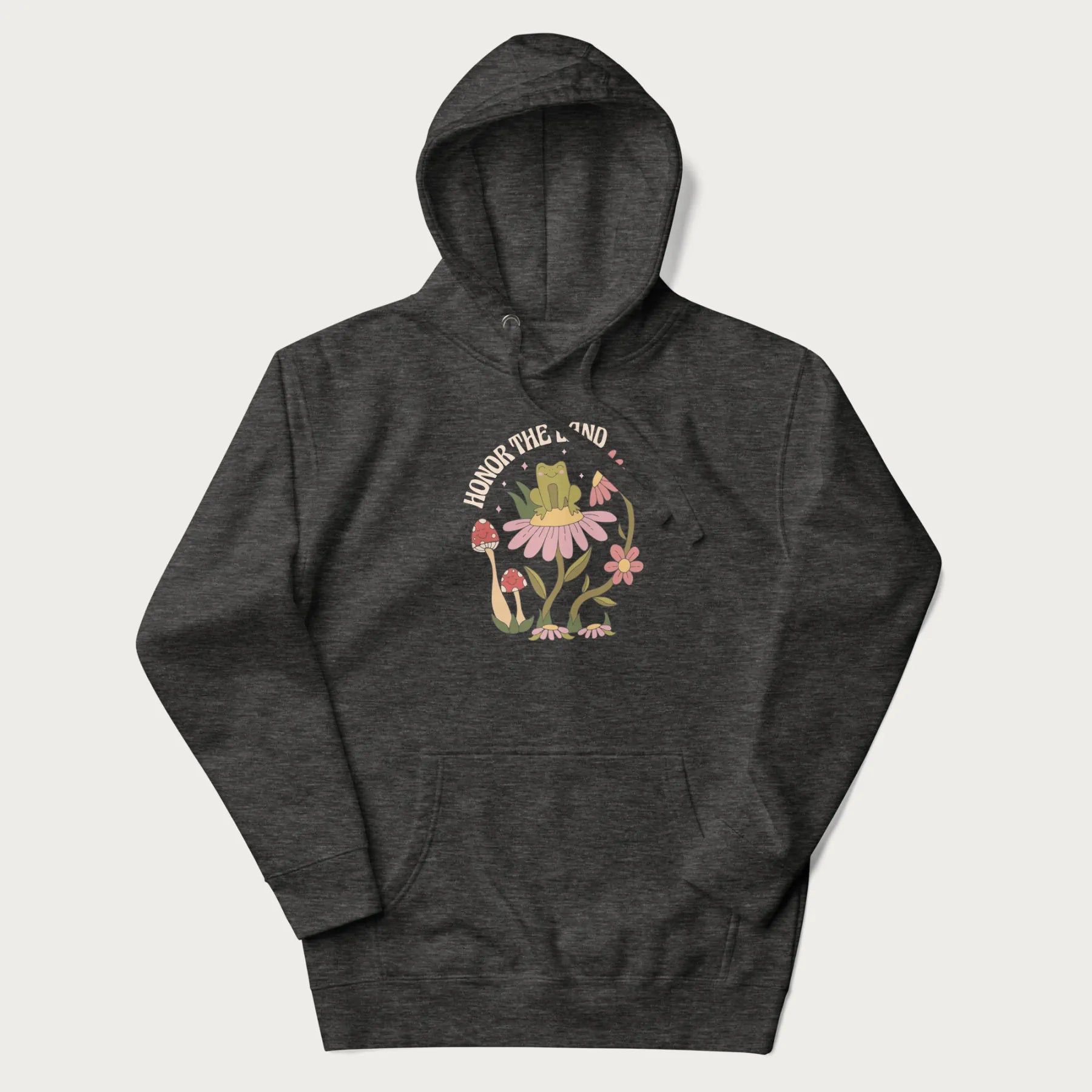 Dark grey hoodie with a graphic of a frog sitting on a flower, surrounded by mushrooms and flowers, with the text 'Honor the Land'.