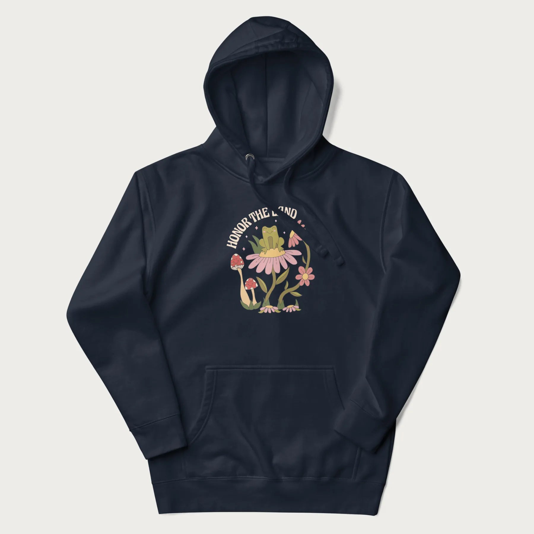 Navy blue hoodie with a graphic of a frog sitting on a flower, surrounded by mushrooms and flowers, with the text 'Honor the Land'.