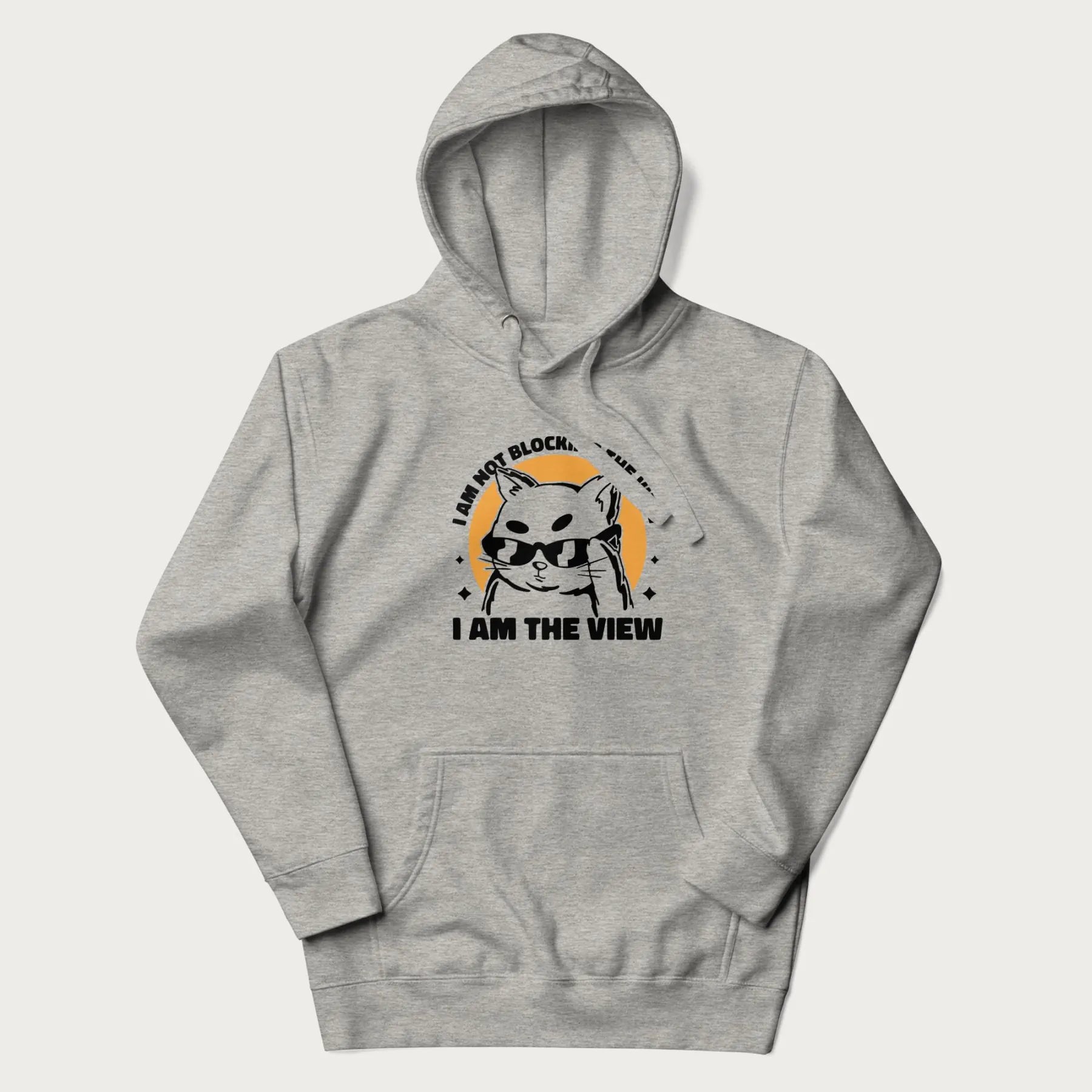Light grey hoodie with a confident cat wearing sunglasses and the phrase 'I am not blocking the view, I am the view'.