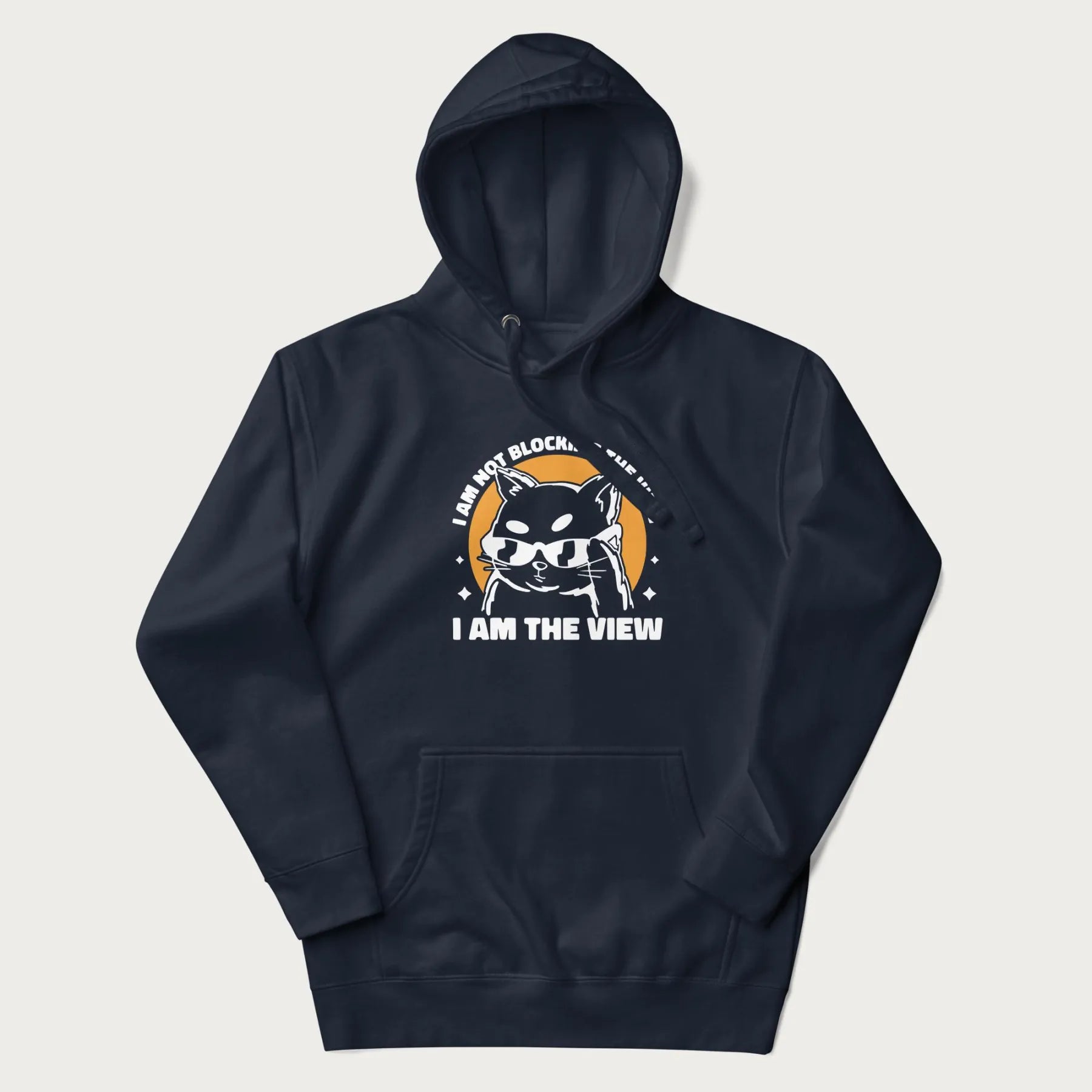 Navy blue hoodie with a confident cat wearing sunglasses and the phrase 'I am not blocking the view, I am the view'.