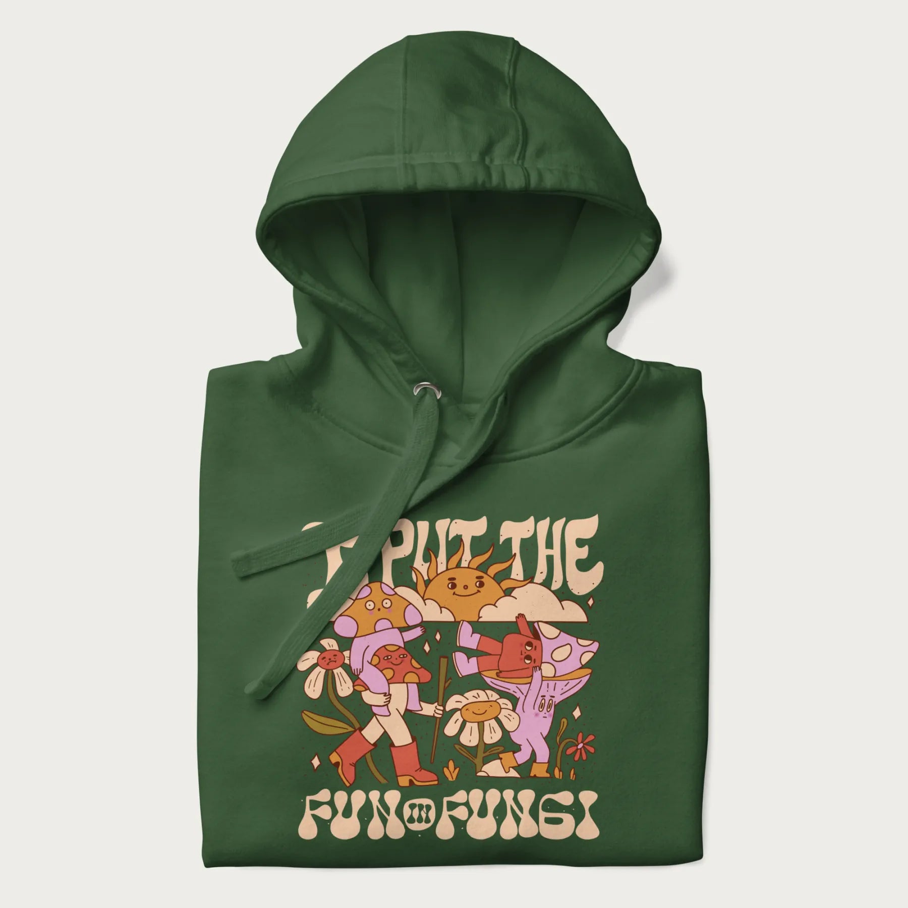 Folded forest green hoodie with a graphic of cheerful mushroom characters and the text 'I Put the Fun in Fungi'.