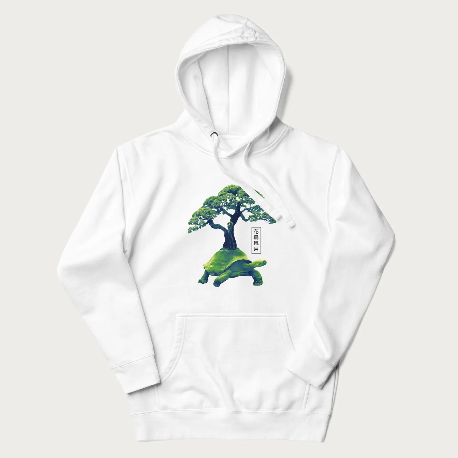White hoodie with a vibrant graphic of a turtle carrying a bonsai tree and Japanese text '花鳥風月.'