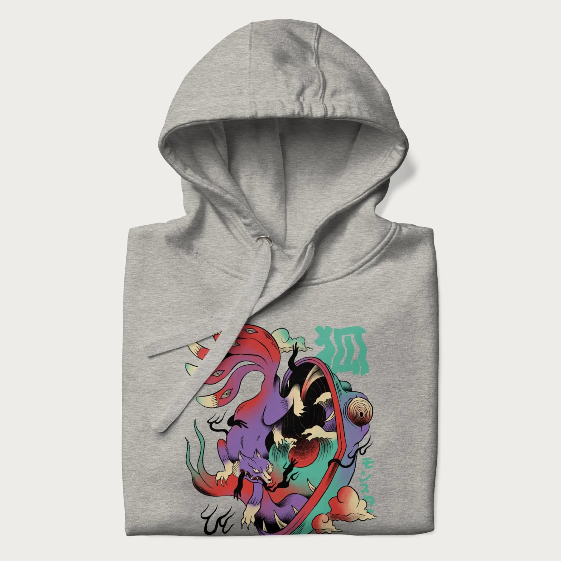 Folded light grey hoodie with Japanese 9 tailed fox graphic and Japanese text '狐' (Fox) and 'モンスター' (Monster), in vivid psychedelic colors.