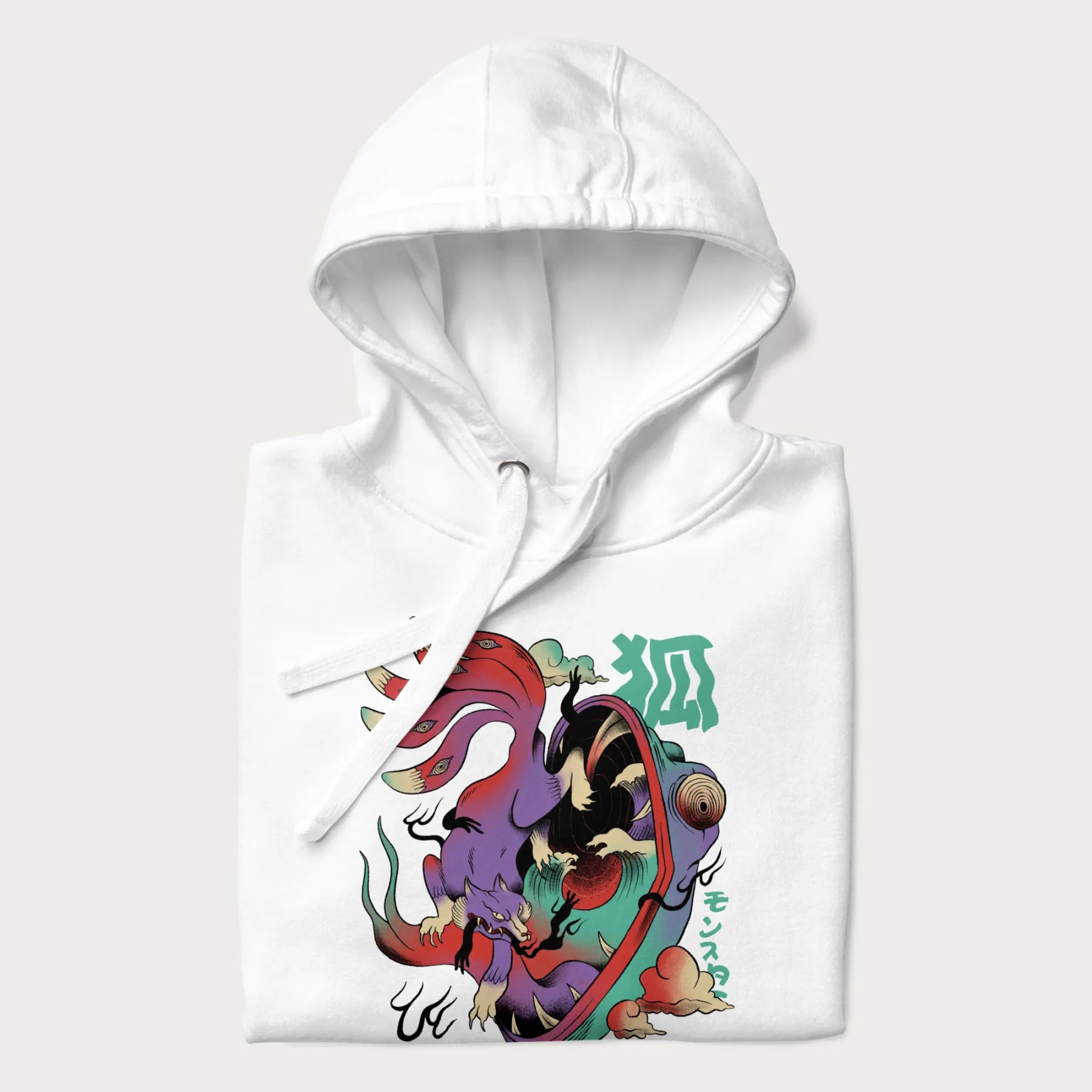Folded white hoodie with Japanese 9 tailed fox graphic and Japanese text '狐' (Fox) and 'モンスター' (Monster), in vivid psychedelic colors.