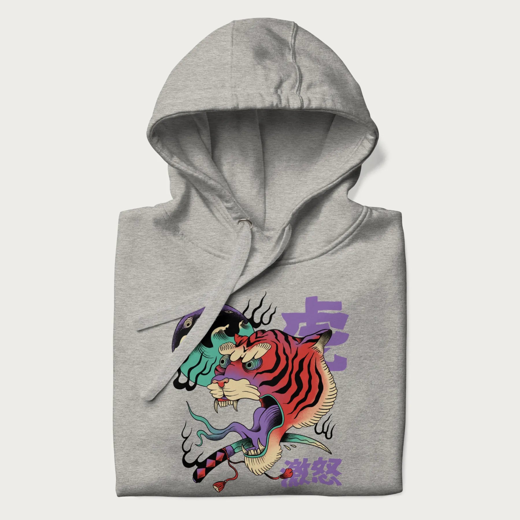 Folded light grey hoodie with Japanese tiger graphic, rendered in vivid orange and purple, with Japanese text '虎' (Tiger) and '激怒' (Rage).