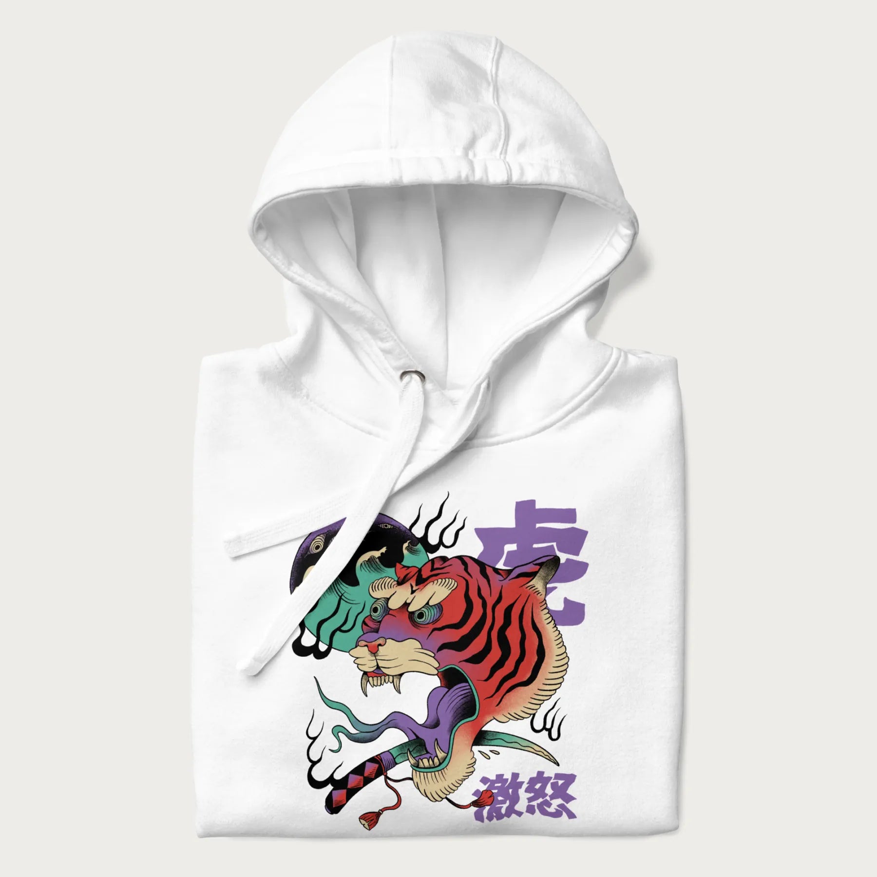 Folded white hoodie with Japanese tiger graphic, rendered in vivid orange and purple, with Japanese text '虎' (Tiger) and '激怒' (Rage).