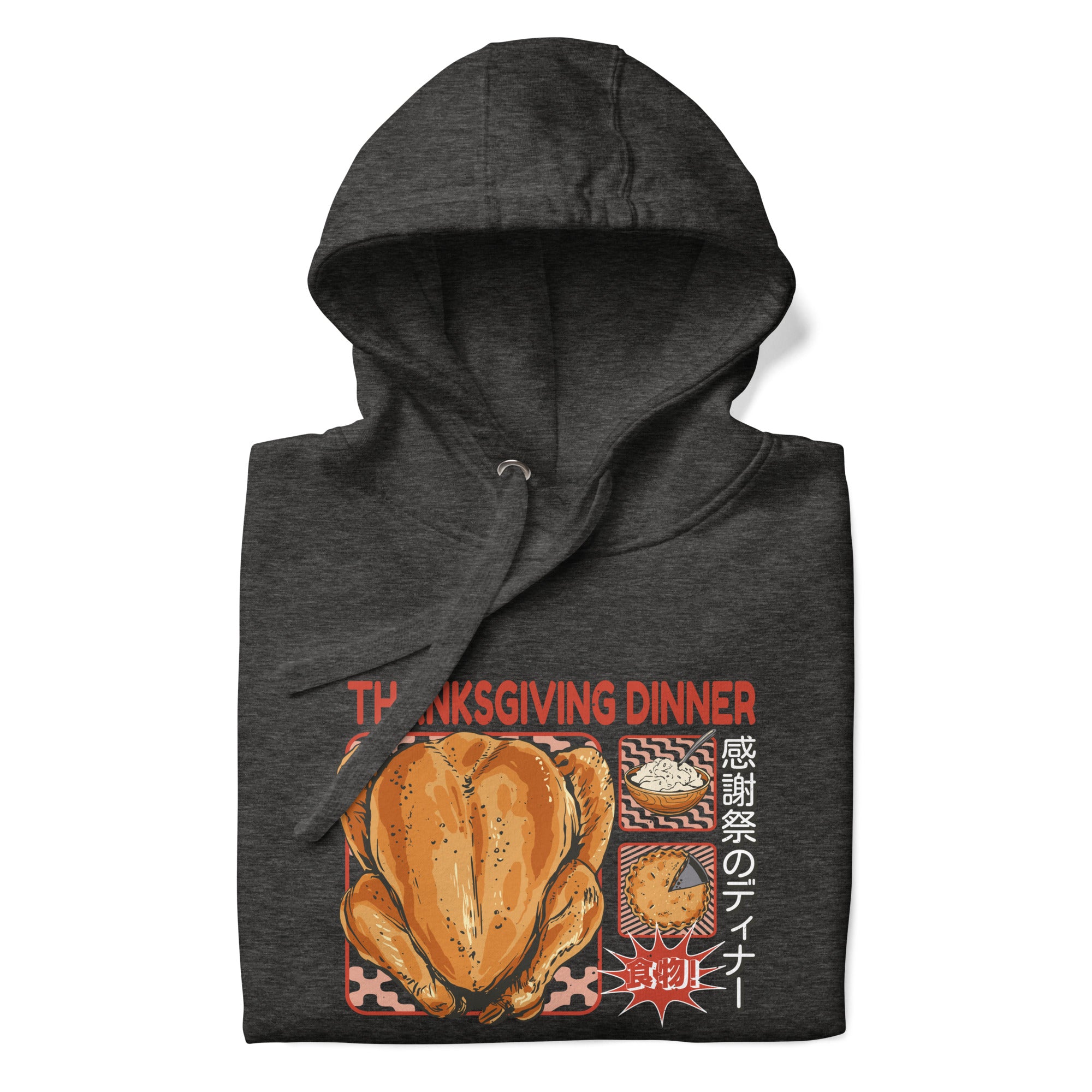 Folded Japanese Thanksgiving Hoodie in Charcoal Heather color: A dark gray hoodie with a heathered texture, featuring a graphic of a Japanese Thanksgiving meal, including a roast chicken, Japanese potato salad, and an apple pie. The hoodie is neatly folded.