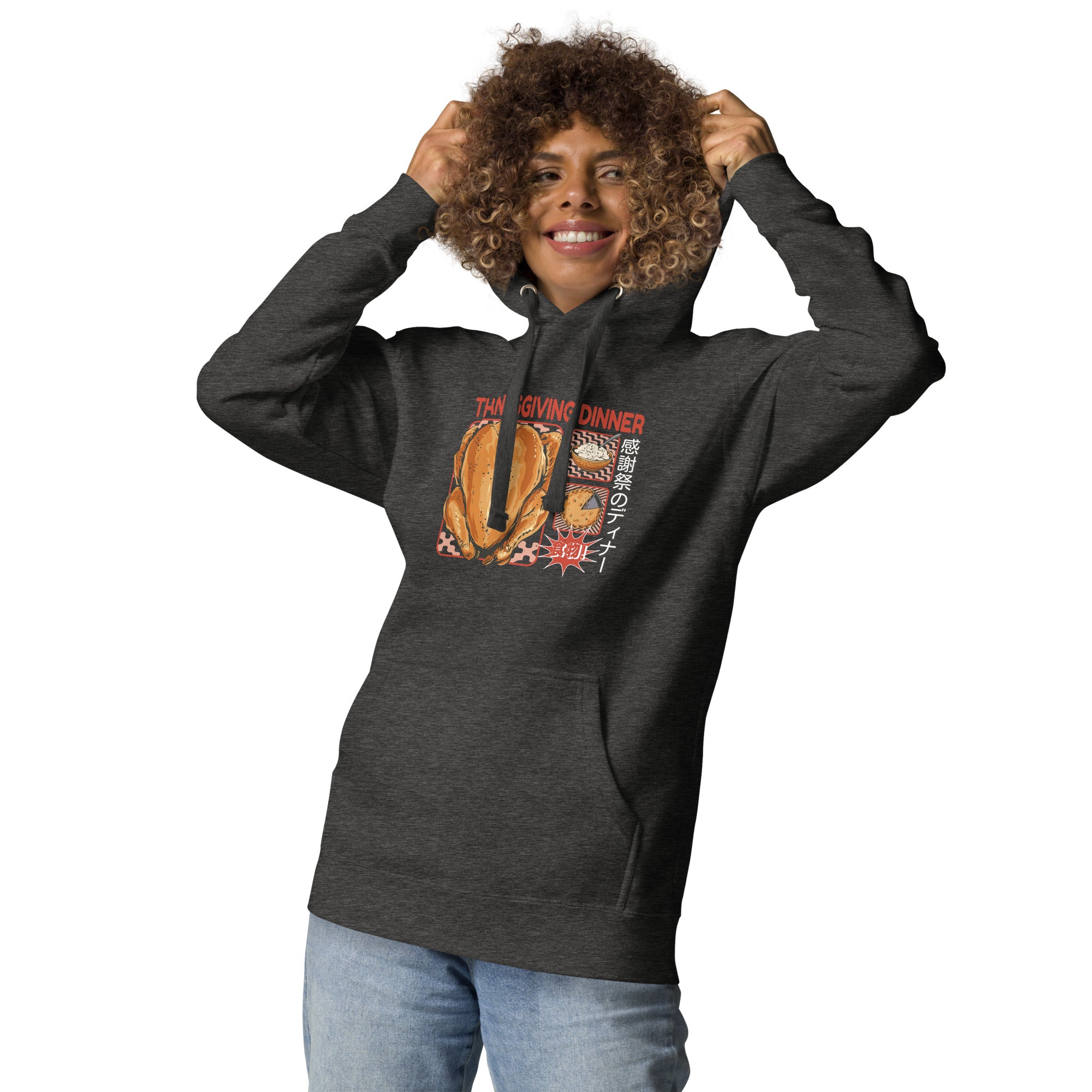Woman wearing a Japanese Thanksgiving hoodie in Charcoal Heather colorway featuring a graphic print of roast chicken, Japanese potato salad, and an apple pie.